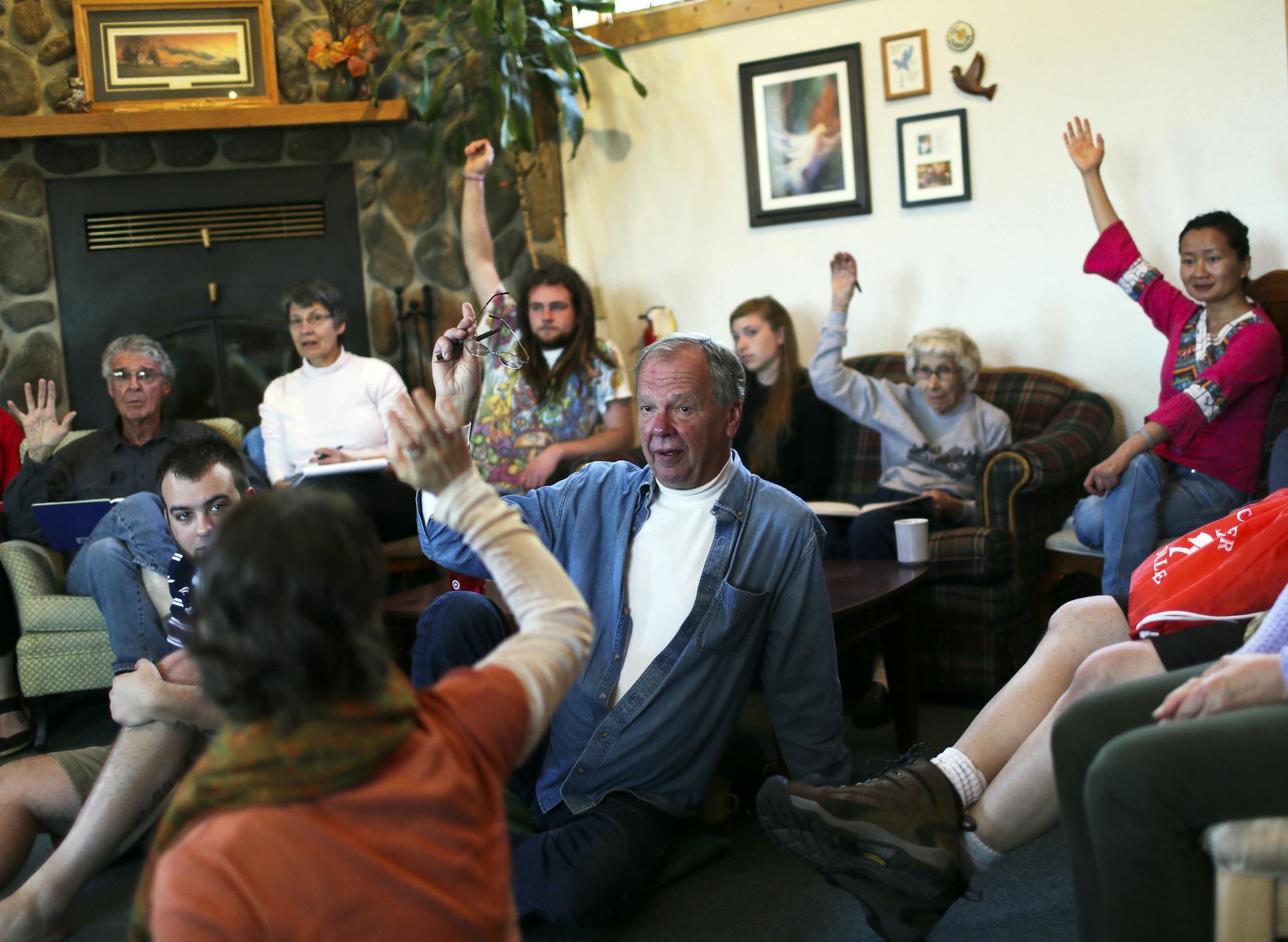 During a morning University of Minnesota philosophy camp meeting, hands of instructors and students go up for those wanting to participate in a nearby town's summer festival parade Monday, June 3, 2013, in Windom, MN.](DAVID JOLES/STARTRIBUNE) djoles@startribune.com A University of Minnesota philosophy camp takes place each spring on the rolling prairie of southwestern Minnesota where students and instructors form a community for living and learning to investigate their own and others responses