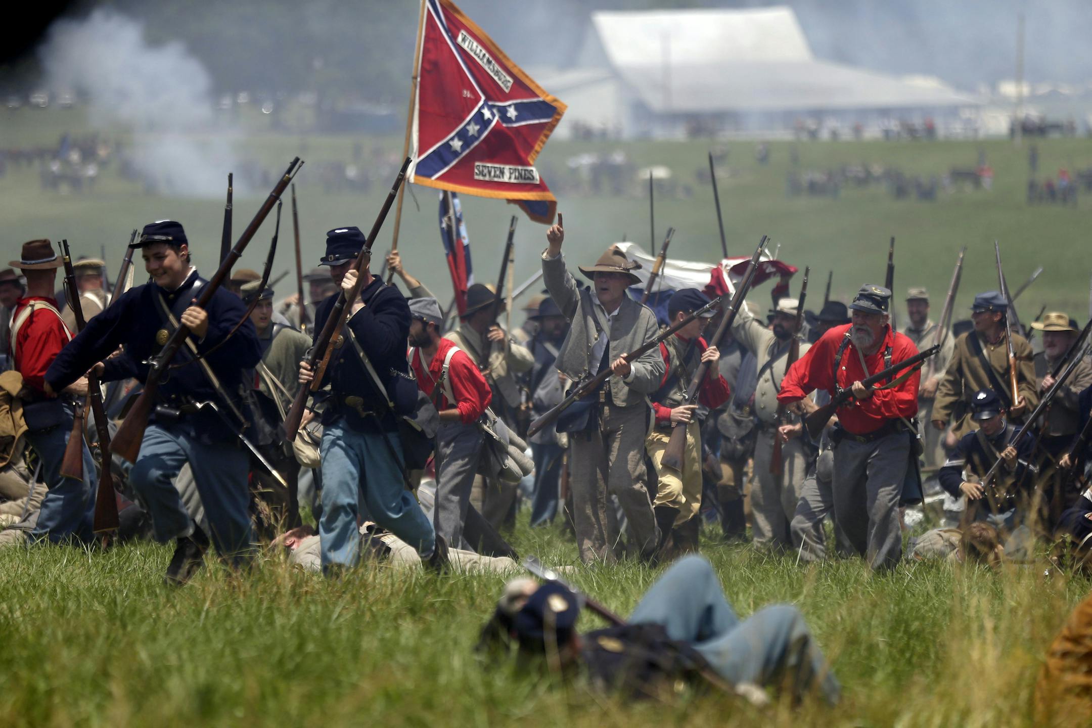 Re-enactors perform Pickett's Charge during ongoing activities commemorating the 150th anniversary of the Battle of Gettysburg, Sunday, June 30, 2013, at Bushey Farm in Gettysburg, Pa. Union forces turned away a Confederate advance in the pivotal battle of the Civil War fought July 1-3, 1863, which was also the warís bloodiest conflict with more than 51,000 casualties. (AP Photo/Matt Rourke)