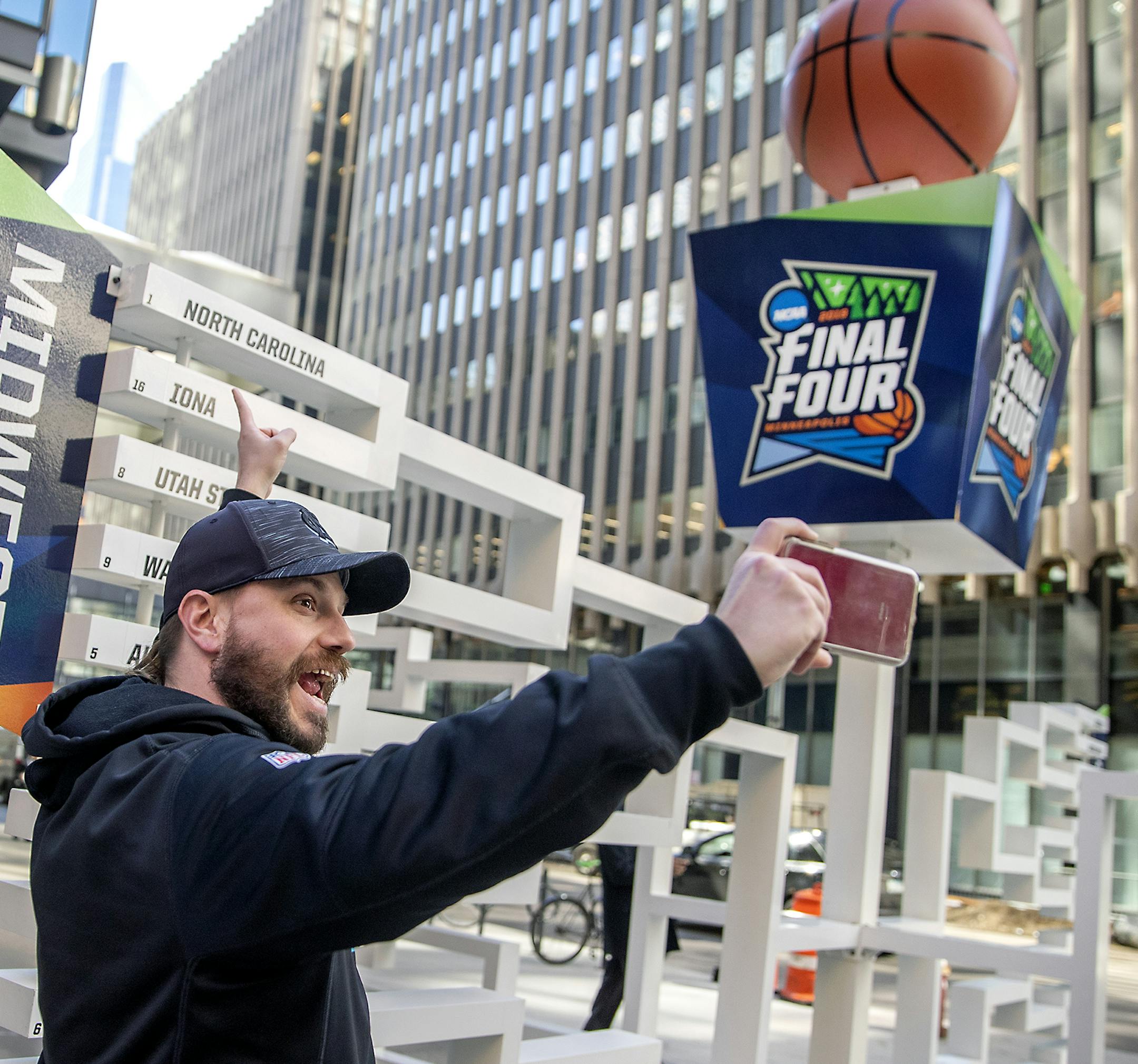 Brad Hardin, cq, took a selfie as he found his favorite team, North Carolina, on a 3D sculpture of the Final Four bracket on the Nicollet Mall just outside the IDS tower, Monday, March 18, 2019 in Minneapolis, MN. ] ELIZABETH FLORES &#x2022; liz.flores@startribune.com