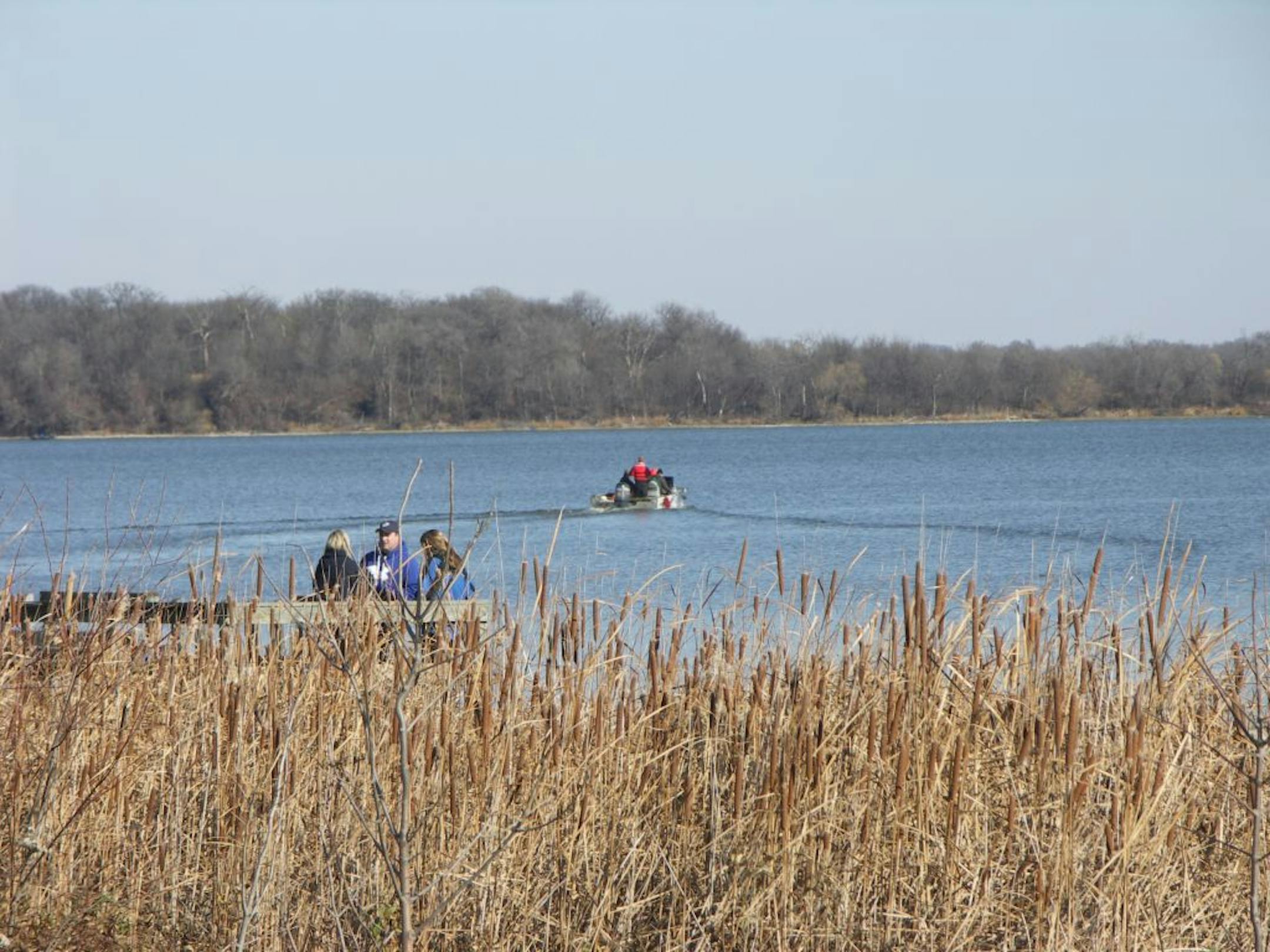 A search crew headed out into the open waters of Lake Elysian where the body of a missing duck hunter was later recovered. Brady Hruska, 17, of Waterville, Minn., was on the lake with four high school friends when their boat overturned about 6 a.m. Four of the teens made it to shore; two were hospitalized, Waseca County sheriff's officials said. Family and friends waited on the dock during the search.
