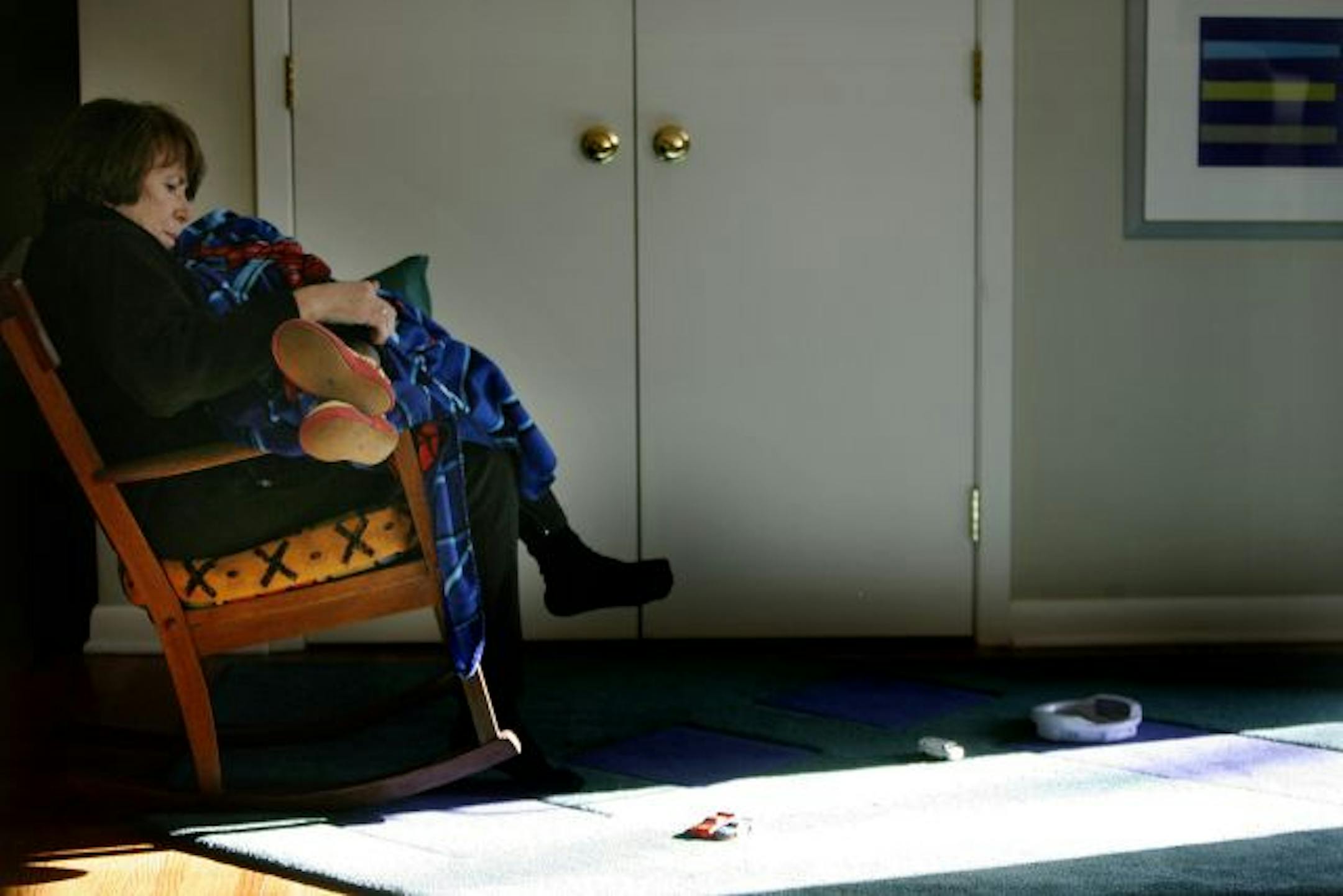 Sandy Schley held Moses after eye surgery at Fairview Southdale Hospital. He had slept for more than five hours and was given a mirror to look at his new set of eyes. He said he wanted to be near light, so Schley rocked him near an open door. Schley first met the little boy in a slum two years ago in Kenya. She calls the effort to help him "the miracle of Moses."