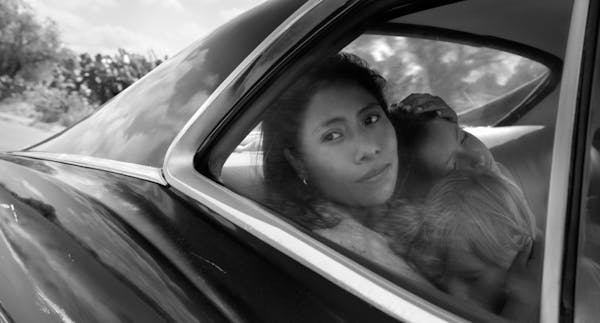 Yalitza Aparicio as Cleo, Marco Graf as Pepe, and Daniela Demesa as Sofi in Roma, written and directed by Alfonso Cuarón. Netflix has scored its firs