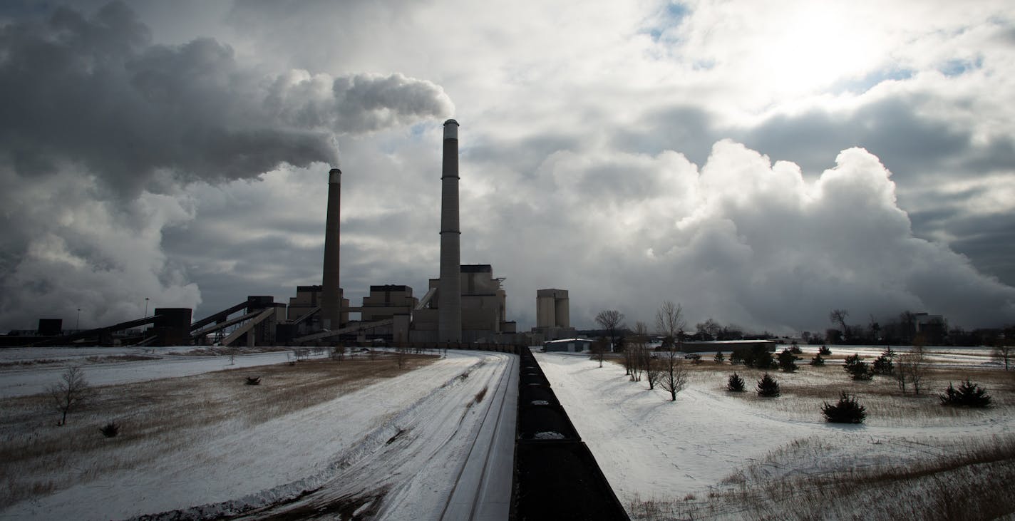 A coal train is idle on the tracks leading to the Sherburne County Generating Station on Wednesday afternoon in Becker. ] AARON LAVINSKY &#xa5; aaron.lavinsky@startribune.com Minnesota power companies have shuttered four smaller power plants and warn that supplies of coal to some of the largest, most important plants are dwindling as BNSF Railway's rail delivery problems persist. Photographs taken at Sherburne County Generating Station on Wednesday, Nov. 12, 2014 in Becker. ORG XMIT: MIN14111218