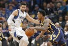 Indiana Pacers' Jeff Teague, right, drives past Minnesota Timberwolves' Ricky Rubio, of Spain, during the first quarter of an NBA basketball game Thur