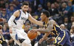 Indiana Pacers' Jeff Teague, right, drives past Minnesota Timberwolves' Ricky Rubio, of Spain, during the first quarter of an NBA basketball game Thur