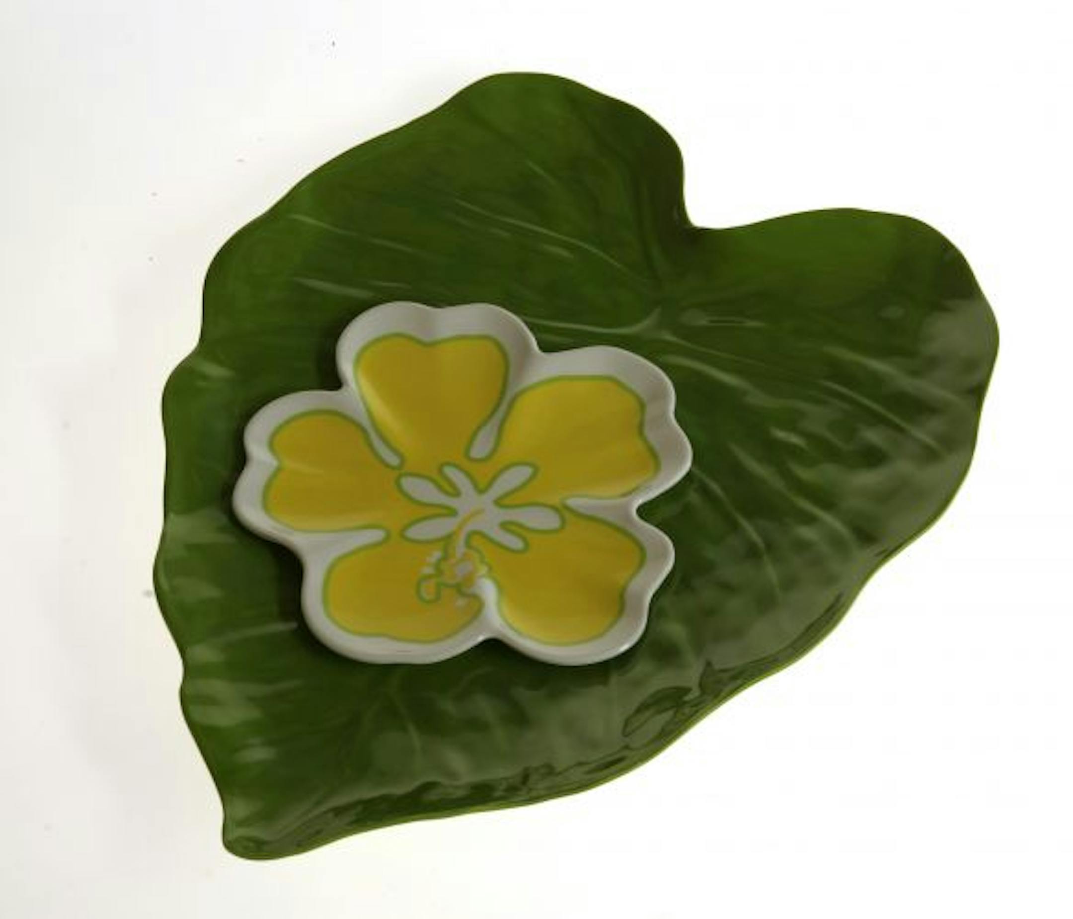 FAKE FLOWERS: Marvelous melamine survives even the rowdiest picnic guest. For sturdy style, try the Tropical Leaf serving tray, 14½ inches wide and 18¼ inches deep, $19.95, and the Tropical Hibiscus Plate, $3.95. Pier 1 stores, see www.pier1.com for locations.
