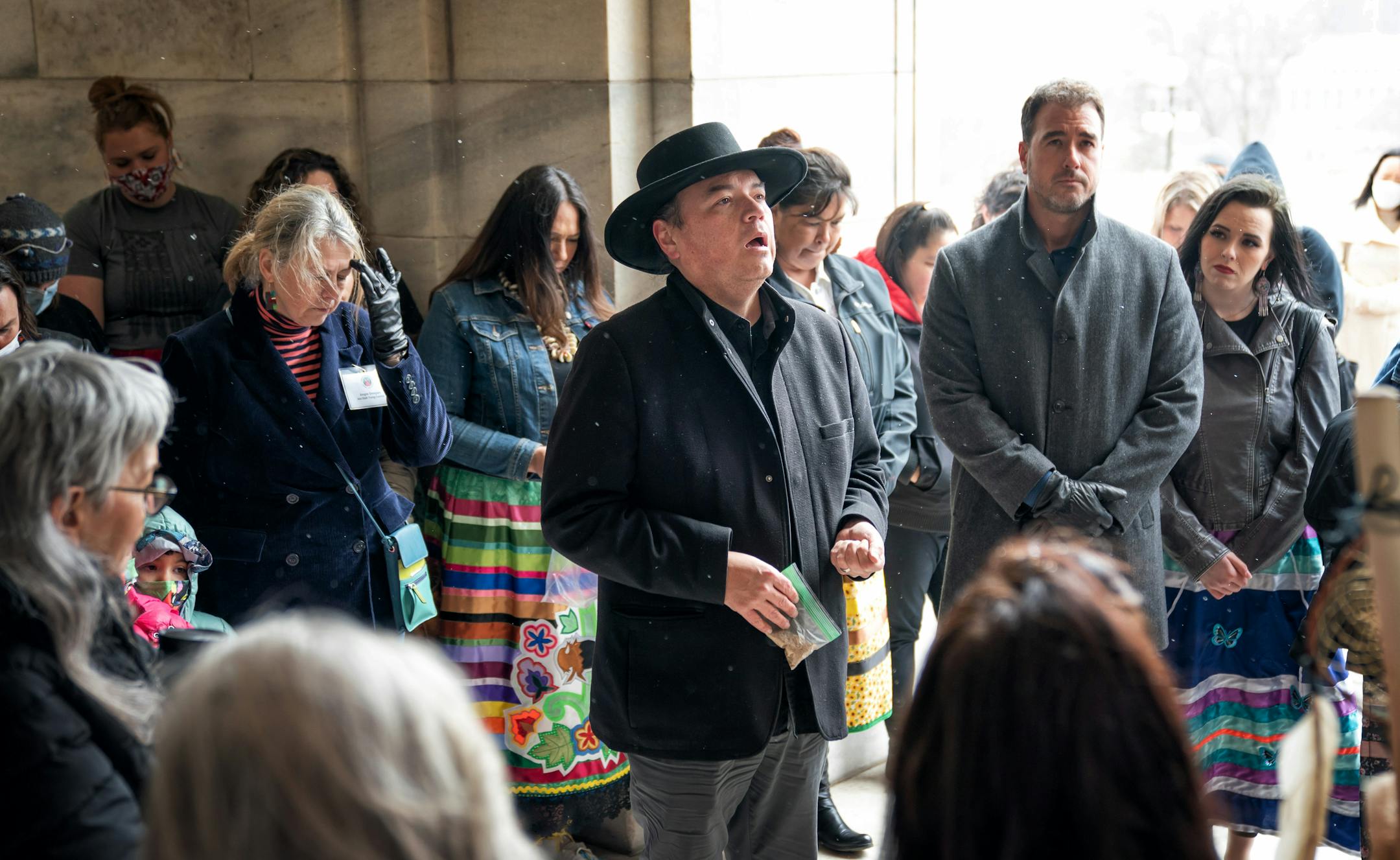 Neil McKay, Dakota language specialist in the American Indian Studies Department at the University of Minnesota, lead a prayer outside the Capitol.