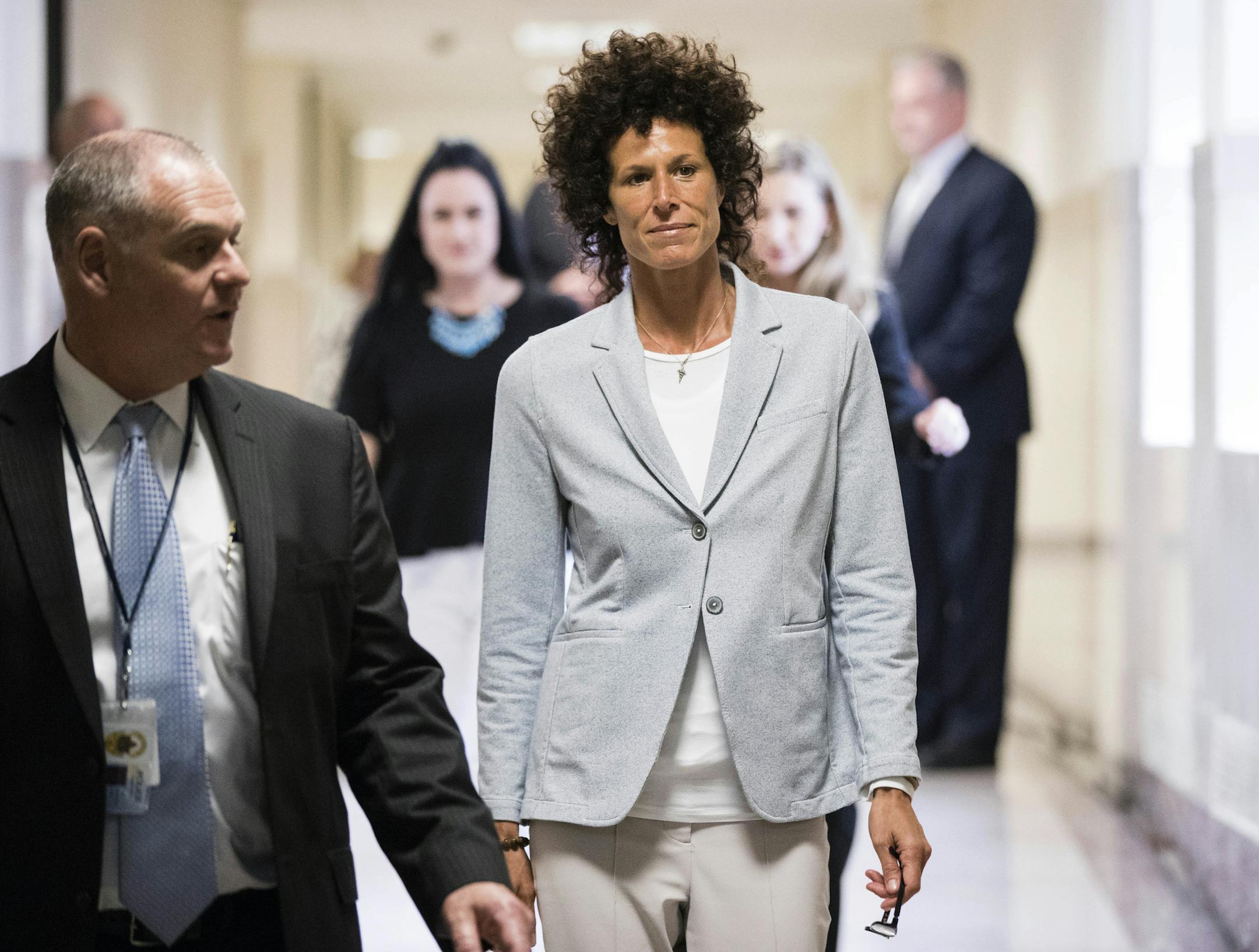 Andrea Constand walks to the courtroom during Bill Cosby's sexual assault trial at the Montgomery County Courthouse in Norristown, Pa., Tuesday, June 6, 2017. Cosby is accused of drugging and sexually assaulting Constand at his home outside Philadelphia in 2004. (AP Photo/Matt Rourke, Pool)