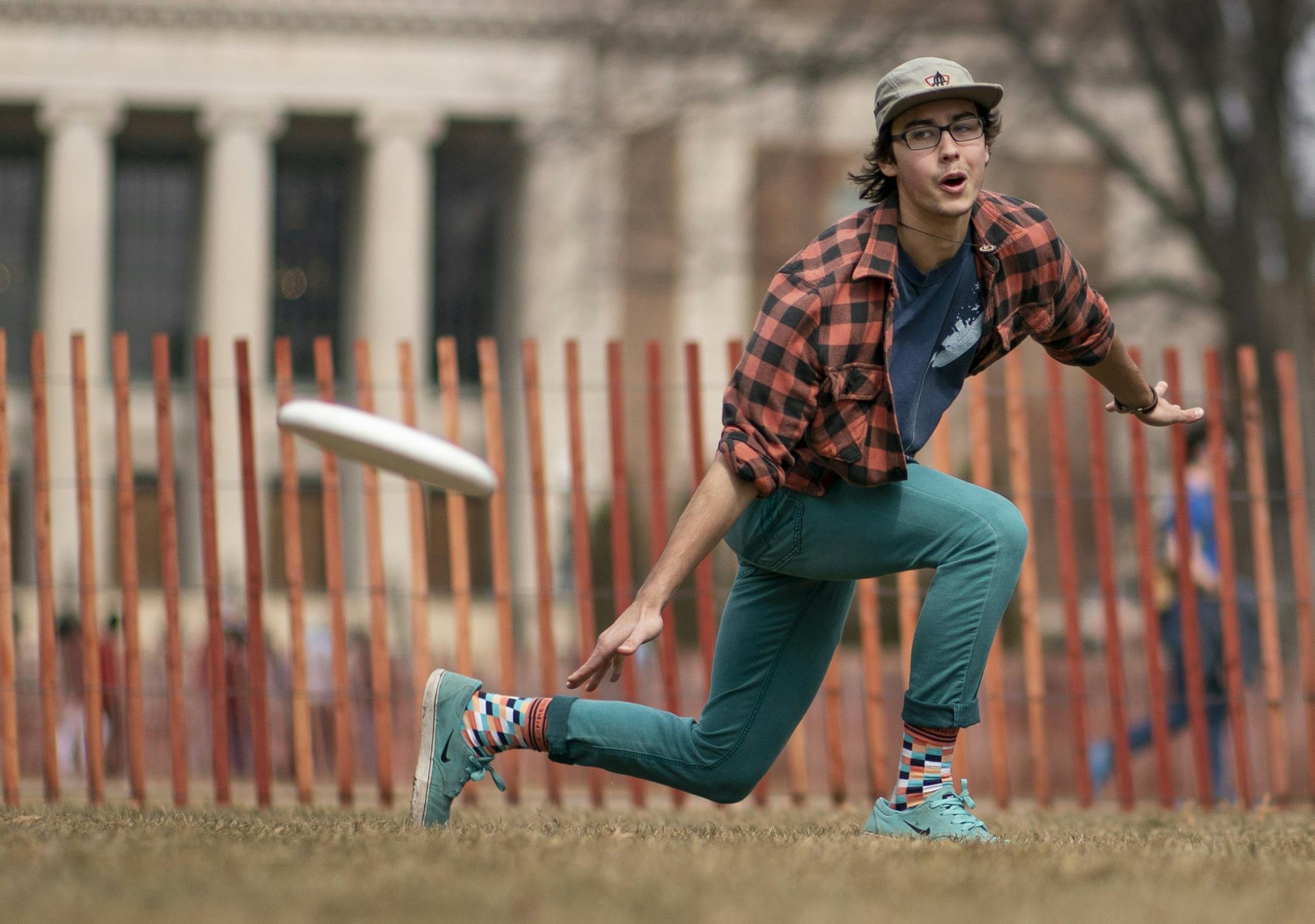 Jonah Jassart a sophomore ecology and Spanish major at the University of Minnesota tossed a frisbee to friends on the mall at the university Wednesday March 27, 2019 in Minneapolis, MN. Jerry Holt • Jerry.holt@startribune.com