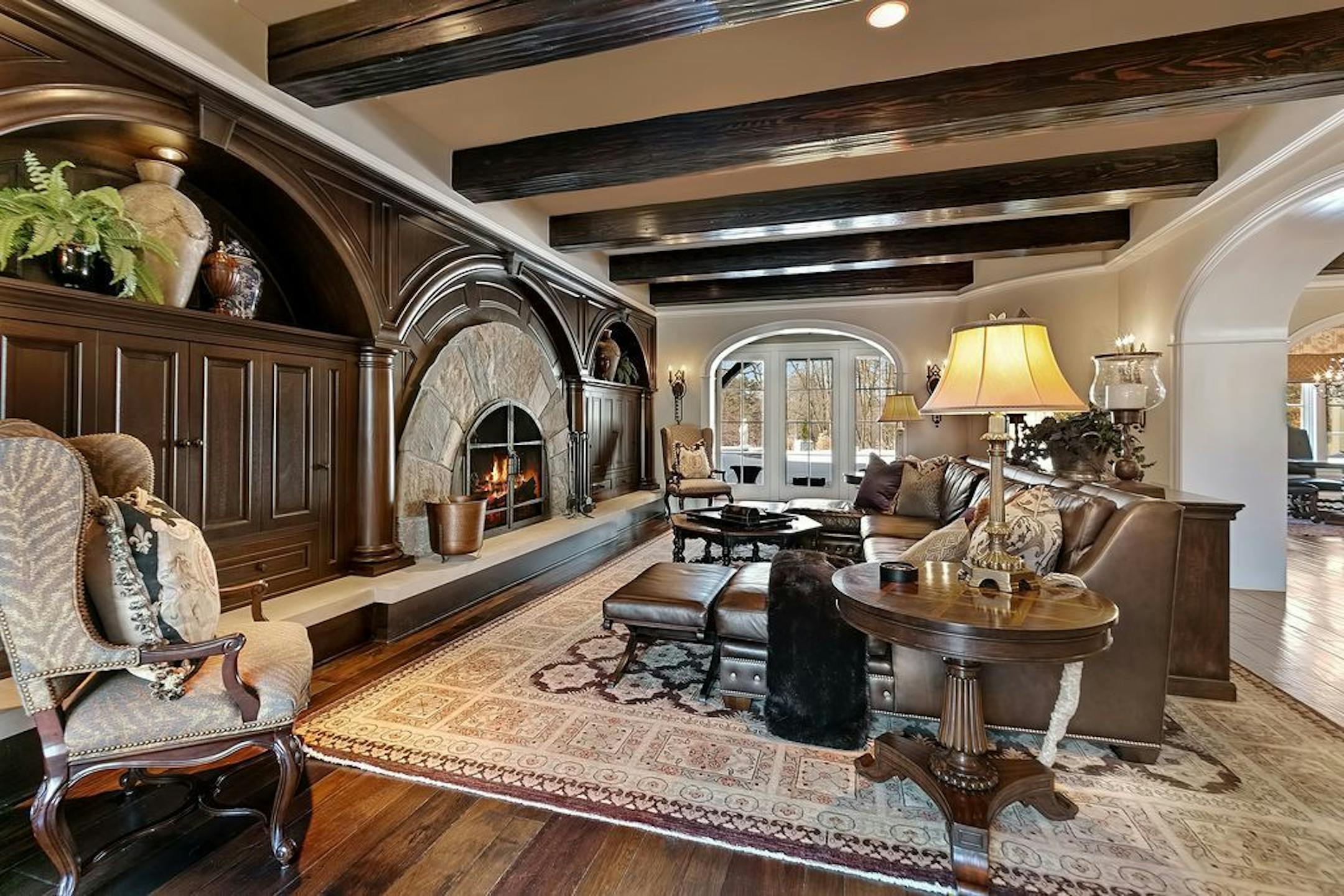 The family room also has a fireplace and reclaimed ceiling beams.