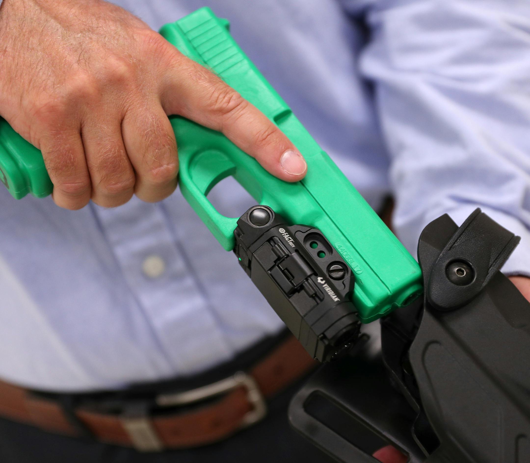 Viridian Weapon Technologies President and CEO Brian Hedeen showed the camera mounted on a police training weapon. ] ANTHONY SOUFFLE &#xef; anthony.souffle@startribune.com West Hennepin Police and city officials, along with Viridian Weapon Technologies based in Maple Plain held a press conference to announce they'd be outfitting all of their officers with cameras mounted on their weapons Thursday, Aug. 16, 2018 at the West Hennepin Public Safety Building in Maple Plain, Minn. The cameras activat