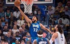 Minnesota Timberwolves center Karl-Anthony Towns (32) shoots during Game 1 Saturday.