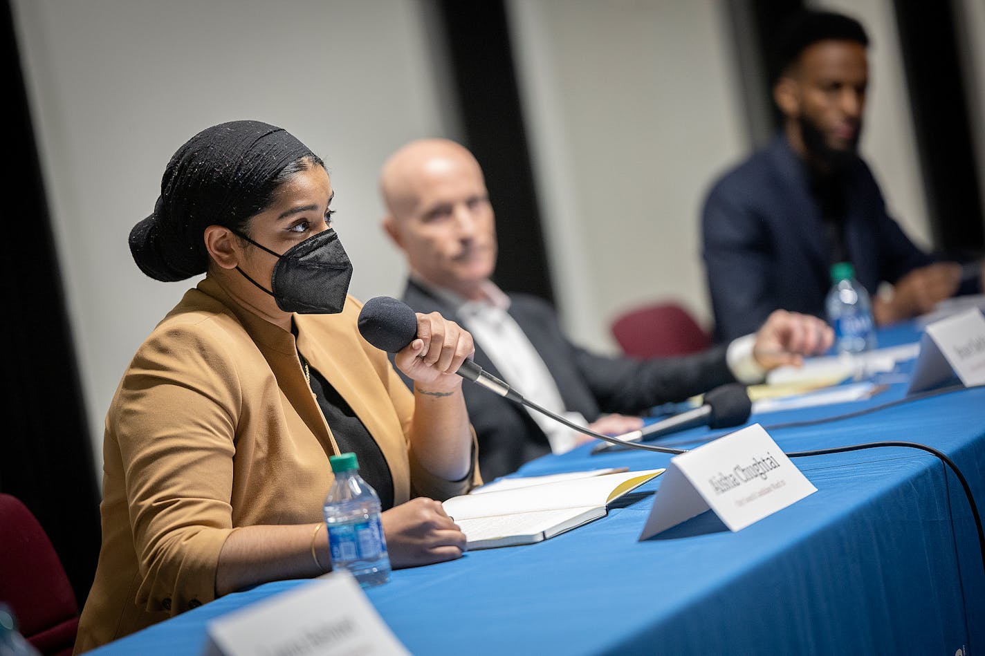 Minneapolis 10th Ward candidates Aisha Chughtai, left, Bruce Dachis, center, and Nasri Warsame, right, answer questions during a forum sponsored by the League of Women Voters at the Abyssinia Cultural Center in Minneapolis on Thursday, Oct. 26, 2023.