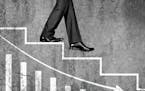 Low section view of a businessman moving down on stairs with graph chart representing the concept of Loss, Failure, Problems etc.