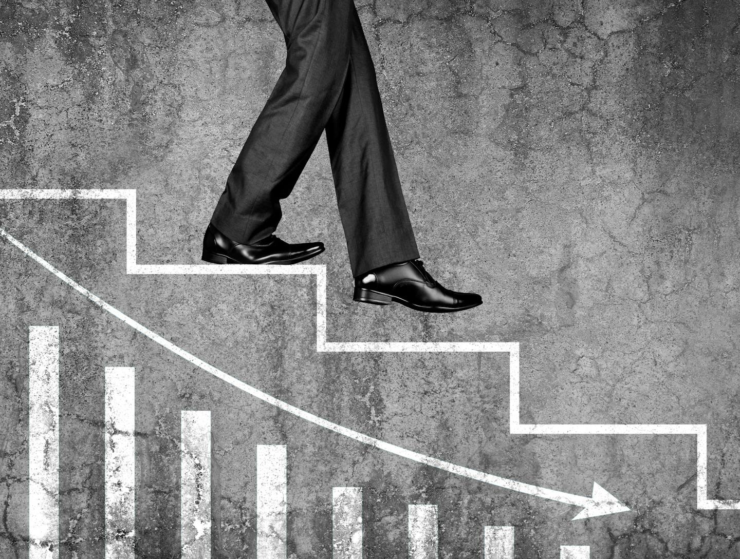 Low section view of a businessman moving down on stairs with graph chart representing the concept of Loss, Failure, Problems etc.