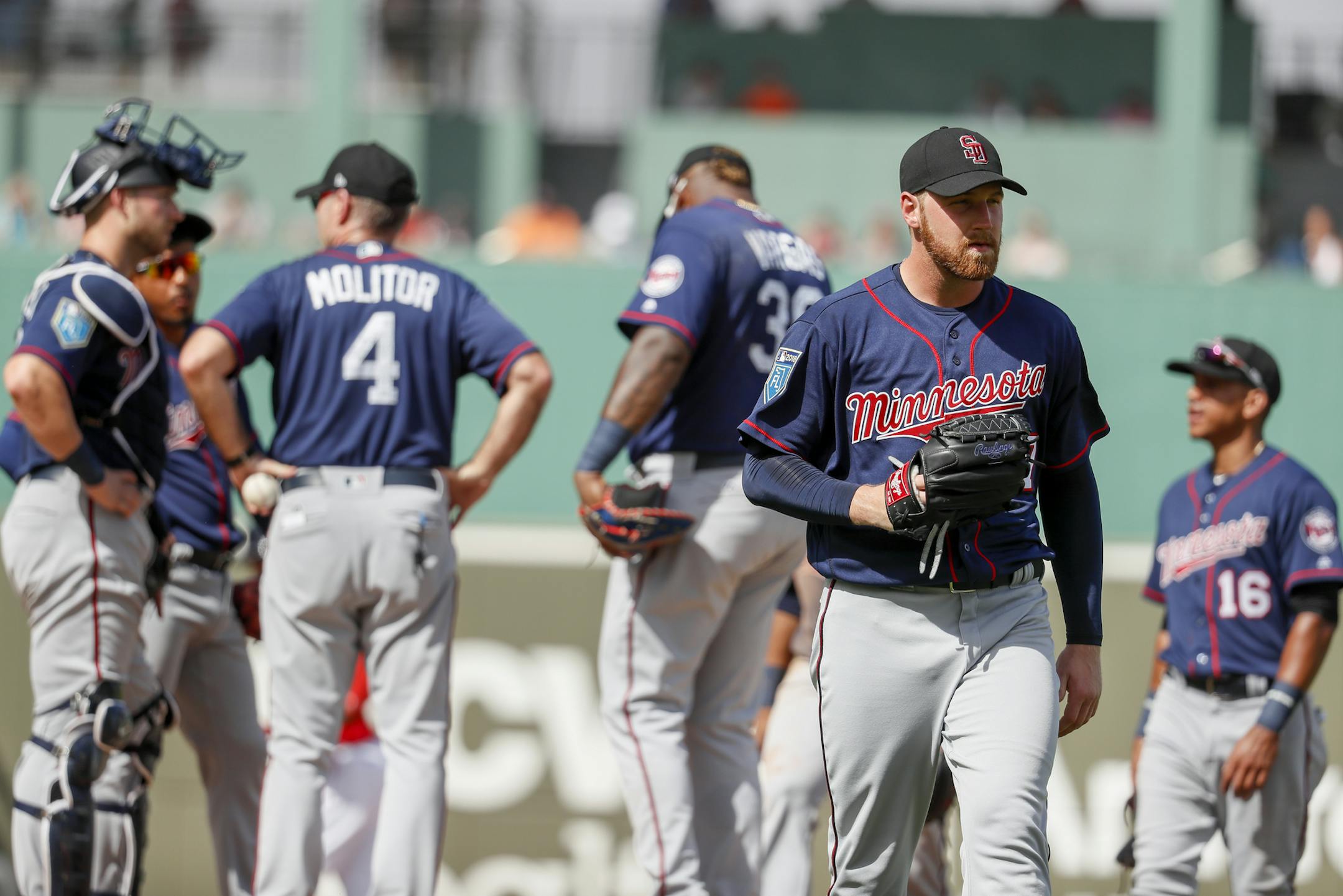 Minnesota Twins starting pitcher Dietrich Enns, right, is relieved after giving up a two-run double to Boston Red Sox Jeremy Barfield in the fourth inning of an spring baseball exhibition game, Friday, Feb. 23, 2018, in Fort Myers, Fla. (AP Photo/John Minchillo)