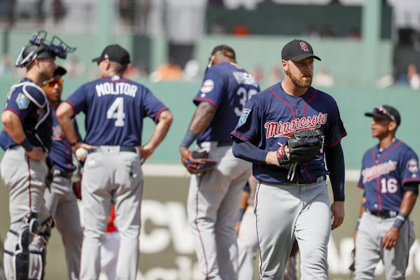 Minnesota Twins starting pitcher Dietrich Enns, right, is relieved after giving up a two-run double to Boston Red Sox Jeremy Barfield in the fourth in