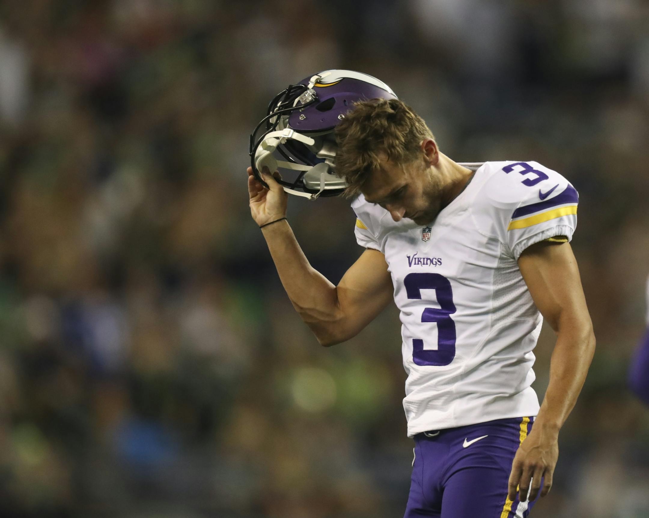 Vikings kicker Blair Walsh took off his helmet after he missed a 47 yard field goal attempt in the fourth quarter Thursday night.