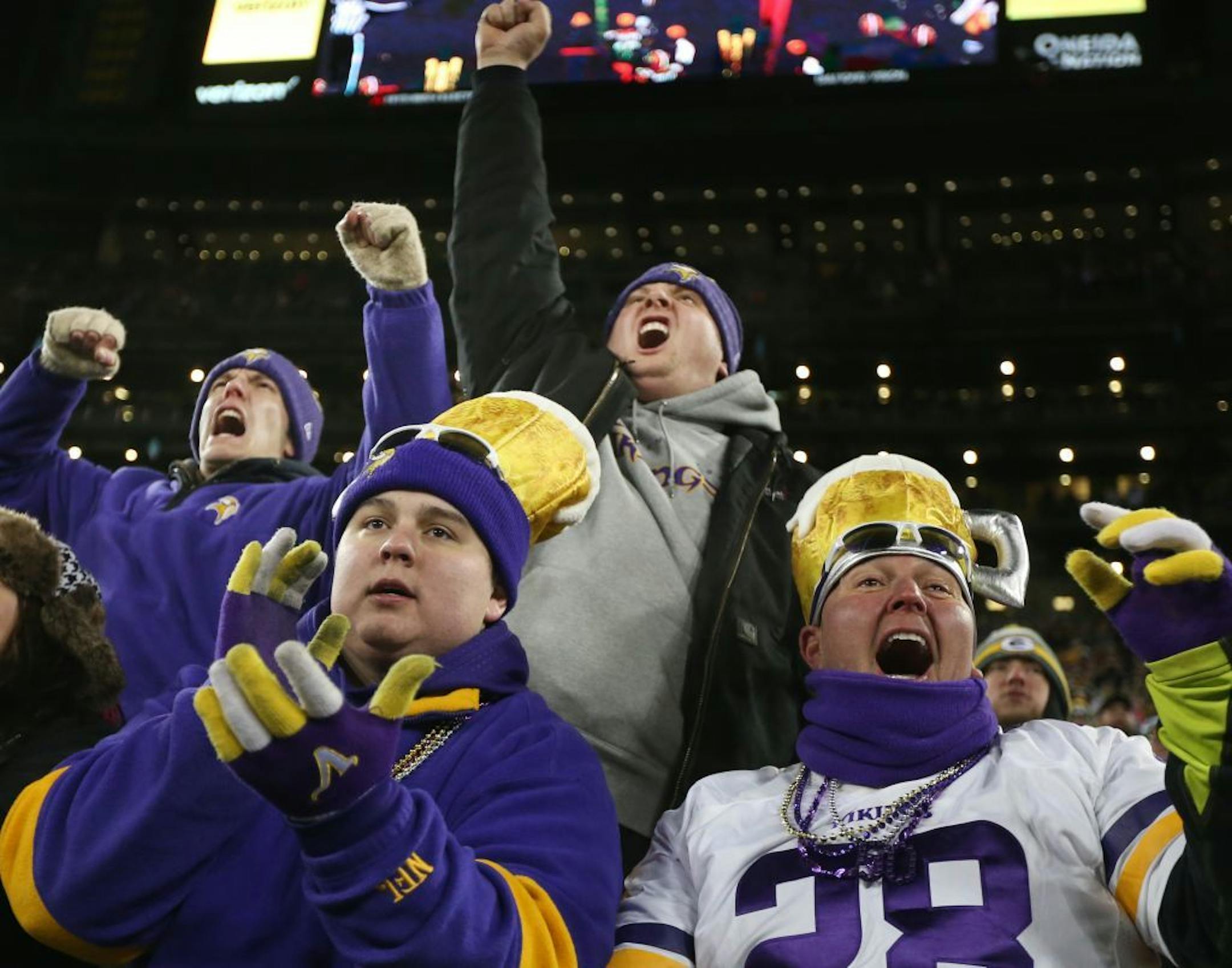 Adam McMurray left and his father Todd McMurray celebrated the Vikings win Sunday January 3, 2016 in Green Bay, Wisconsin.