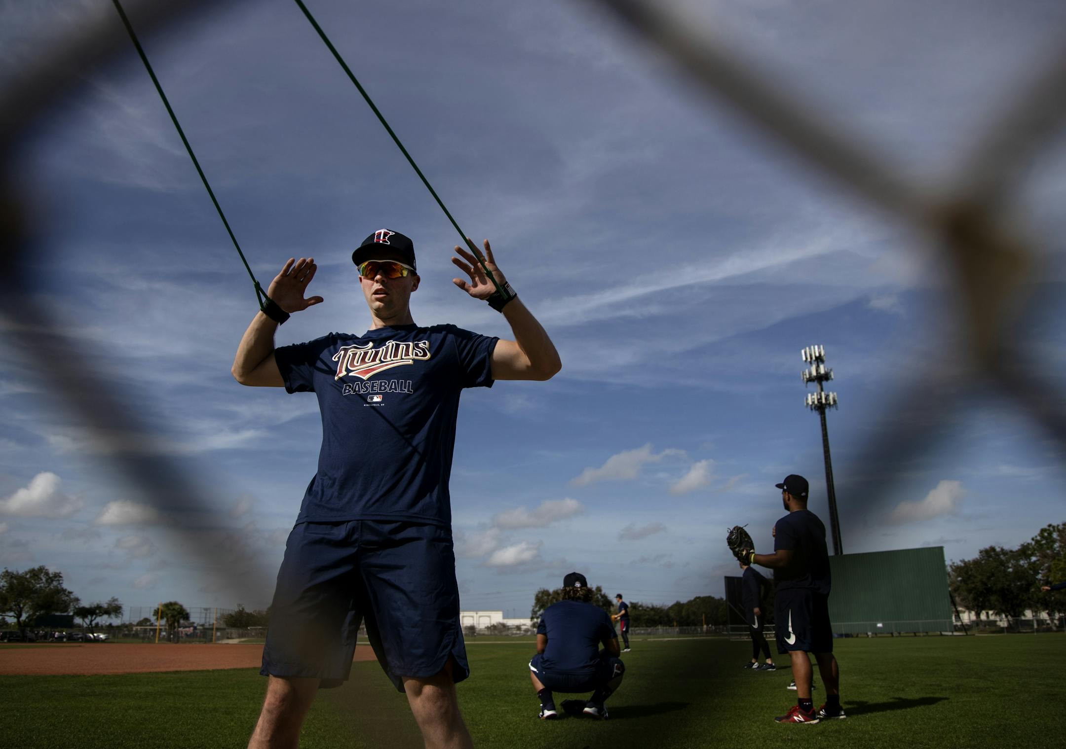 Minnesota Twins pitcher Sean Poppen stretched out before a workout on Tuesday.