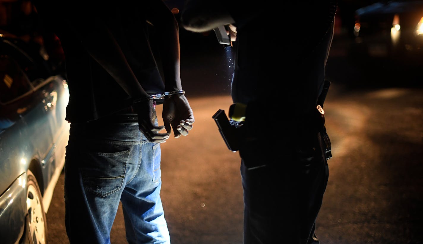 A St. Paul Police officer prepared to removed handcuffs from a man who was detained and questioned following a suspicious activity call. Three of the four men in the group were released and one was arrested for an outstanding warrant. ] AARON LAVINSKY • aaron.lavinsky@startribune.com Police work is being scrutinized like never before. Across the country and Minnesota, the officer-involved killings of civilians -- Justine Damond, Philando Castile, and Jamar Clark -- have altered the public percep