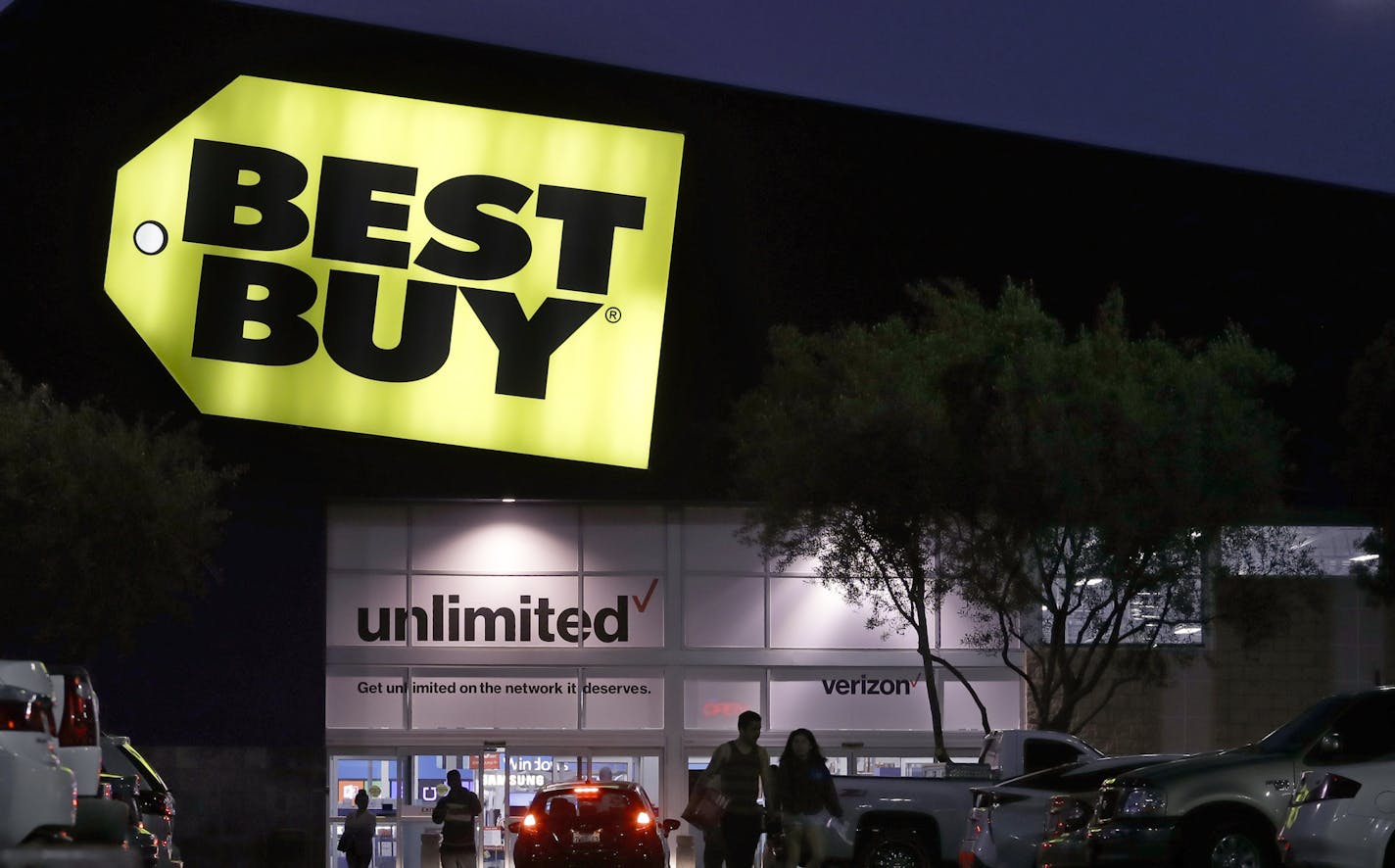 Shoppers make their way around the parking lot at the Best Buy store Tuesday, May 23, 2017, in Orange, Calif. (AP Photo/Chris Carlson)