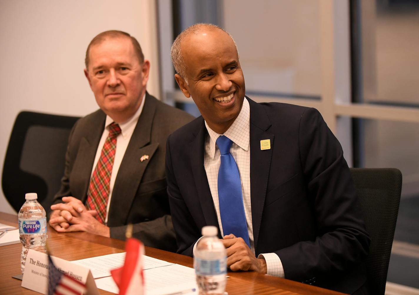 Ahmed Hussen, Canada's immigration minister and a former Somali refugee, listened as refugee resettlement advocates and officials introduced themselves at the start of Friday's roundtable discussion. ] AARON LAVINSKY &#x2022; aaron.lavinsky@startribune.com Ahmed Hussen, Canada's immigration minister and a former Somali refugee, hosted a roundtable discussion with refugee resettlement advocates and officials on Friday, Dec. 8, 2017 at the 701 Building in Minneapolis, Minn.