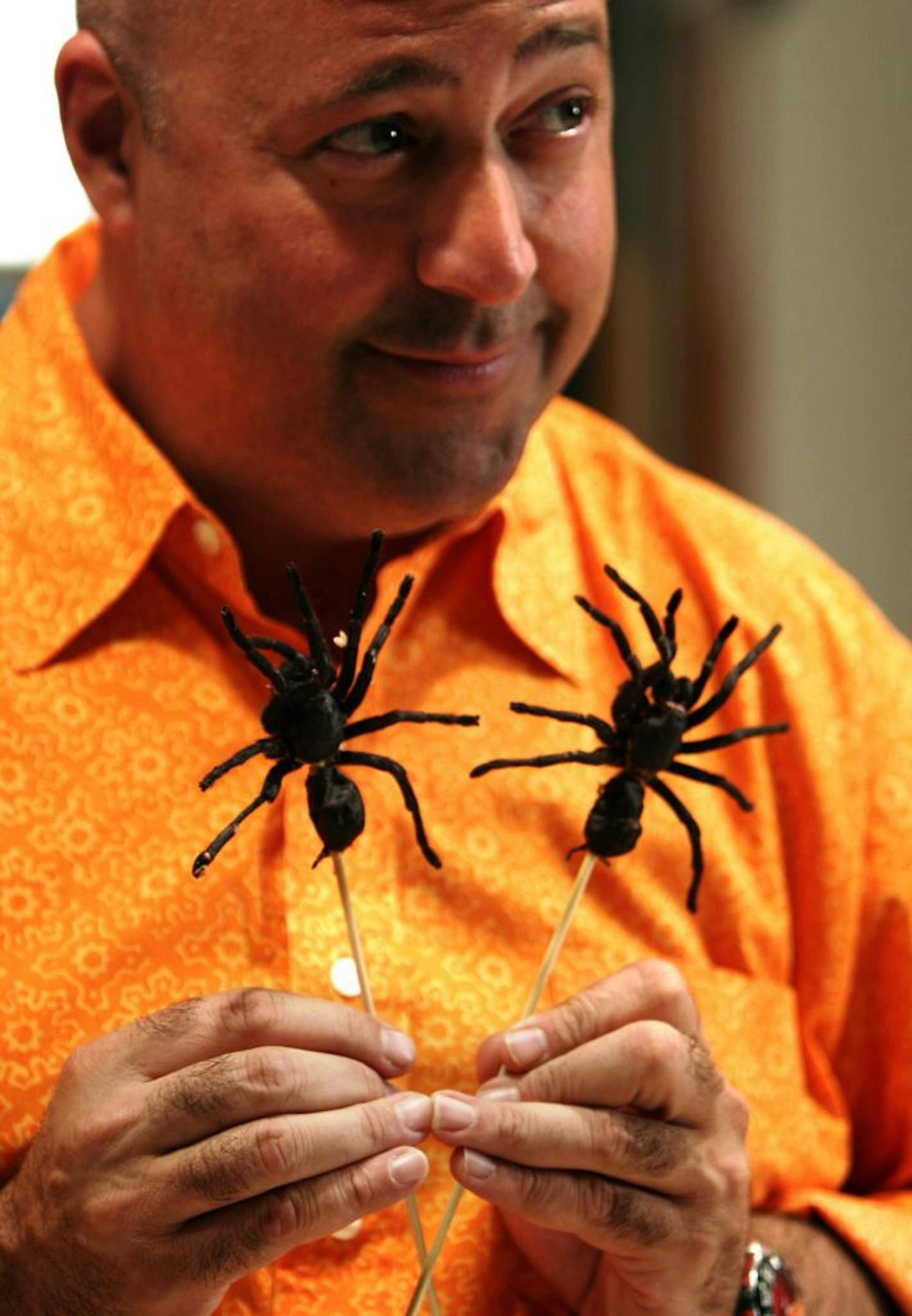 With Teriyaki Tarantula's on a stick, Andrew Zimmern does a promo for his new Travel Channel show "Bizarre Foods" at Gene Rurka's farm in New Jersey. Photo by Scott Lewis 917-386-4555