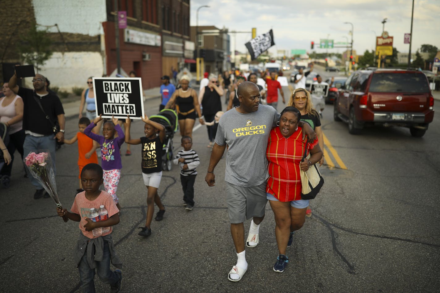 Thurman Blevins' brother, Joseph Blevins, walked with his arm around his cousin, Melinda Blevins, as they walked on W. Broadway Ave. with others to honor Thurman Thursday evening. ] JEFF WHEELER &#xef; jeff.wheeler@startribune.com A rally and then a Peace Walk in memory of Thurman Blevins was organized by a several organizations and held on W. Broadway Ave. Thursday evening, June 28, 2018 in Minneapolis. After some tributes by members of Blevins family and some speeches by activists, the group w