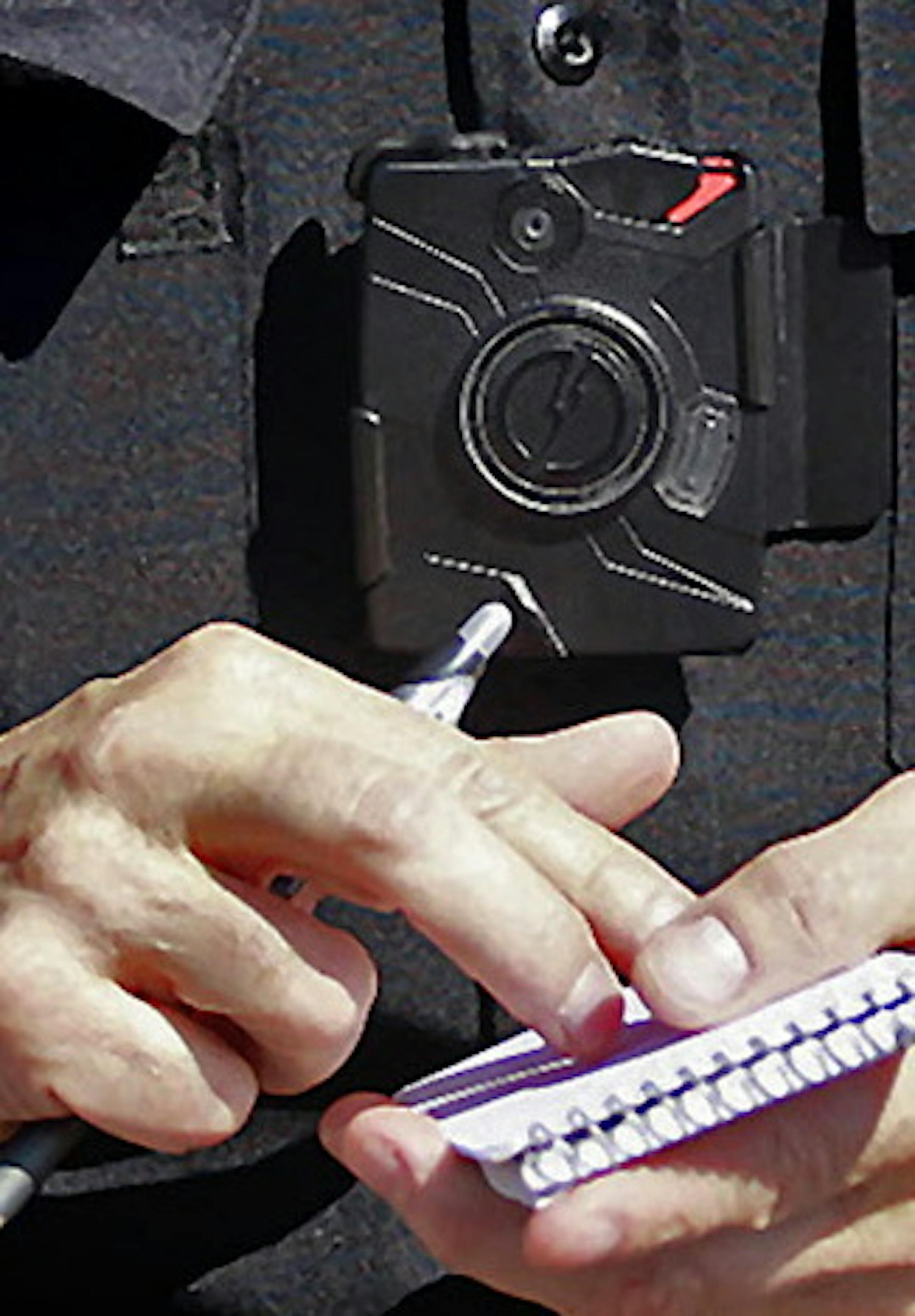 Columbia Heights police officer Terry Nightingale made sure to turn on his body cam before talking a pedestrian for dangerously crossing the street, Friday, April 17, 2015 in Columbia Heights, MN. ] (ELIZABETH FLORES/STAR TRIBUNE) ELIZABETH FLORES &#xef; eflores@startribune.com ORG XMIT: MIN1504171413232859 ORG XMIT: MIN1509111304160081