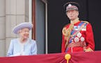 Queen Elizabeth II and the Duke of Kent watch from the balcony of Buckingham Place after the Trooping the Color ceremony in London, Thursday, June 2, 