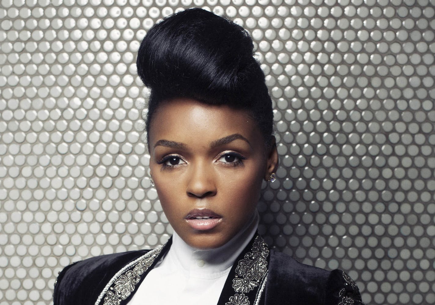 FILE - In this Aug. 12, 2013 file photo, American R&B and soul musician, composer and record producer Janelle Monae poses for a portrait at Dream Downtown in New York. The Grammy-nominated singer released her full-length sophomore album, &#x201c;The Electric Lady,&#x201d; on Tuesday, Sept. 10, 2013. It features collaborations with Prince, Erykah Badu, Miguel, Esperanza Spalding and Solange. (Photo by Victoria Will/Invision/AP, File)