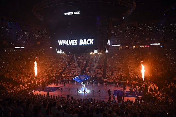 Flames shot up from the basket standards during player introductions before Game 6 of the NBA Western Conference semifinal game between the Timberwolv