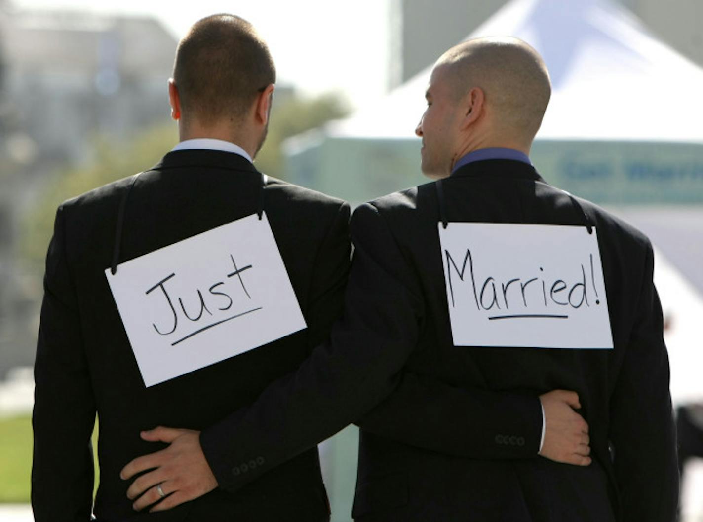 SAN FRANCISCO - JUNE 17: Same-sex couple Ariel Owens (R) and his spouse Joseph Barham walk arm in arm after they were married at San Francisco City Hall June 17, 2008 in San Francisco, California. Same-sex couples throughout California are rushing to get married as counties begin issuing marriage license after a State Supreme Court ruling to allow same-sex marriage.