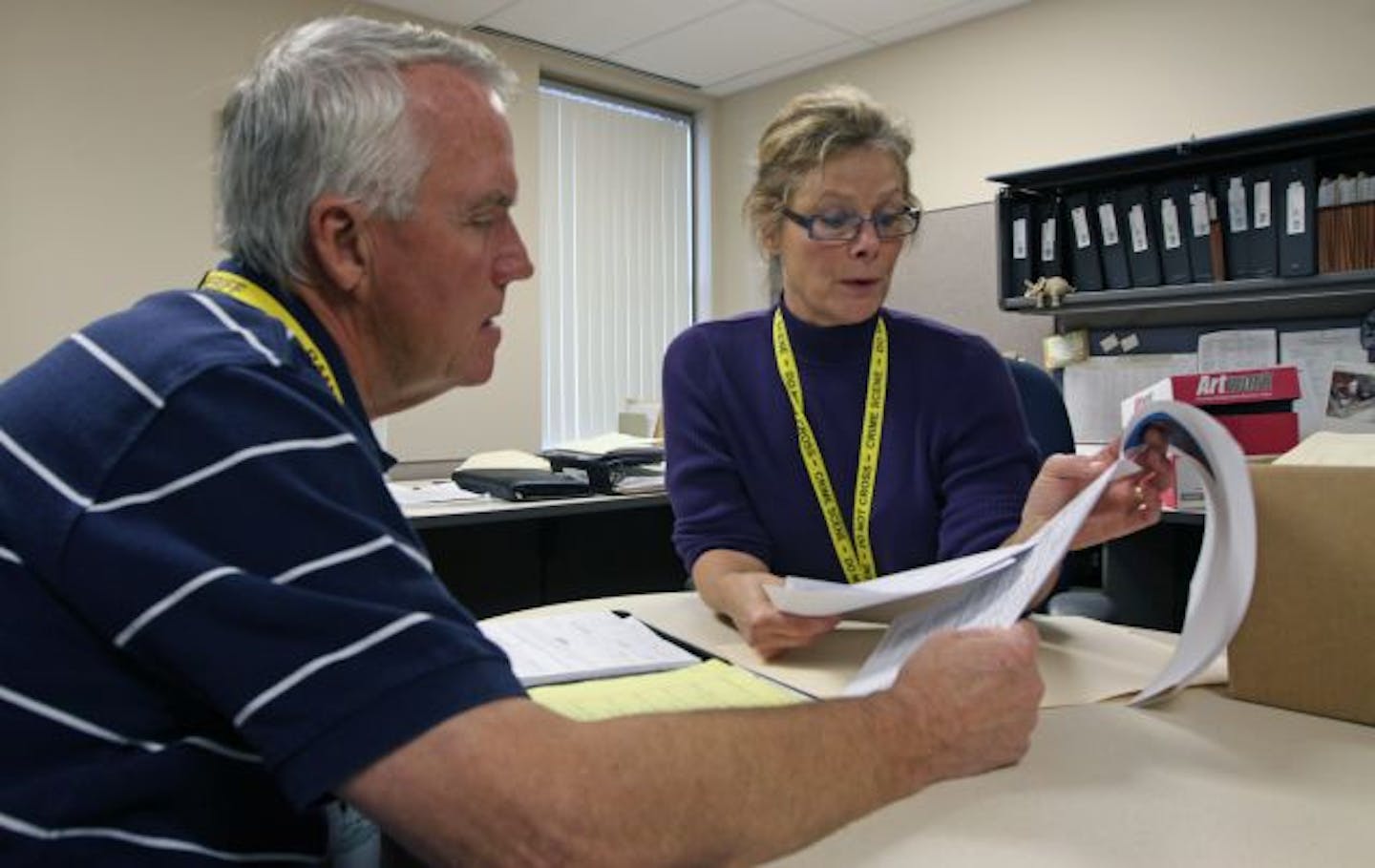 Retired St. Paul homicide detective Bob Paskett and Sgt. Anita Muldoon reviewed files from a 1992 slaying.