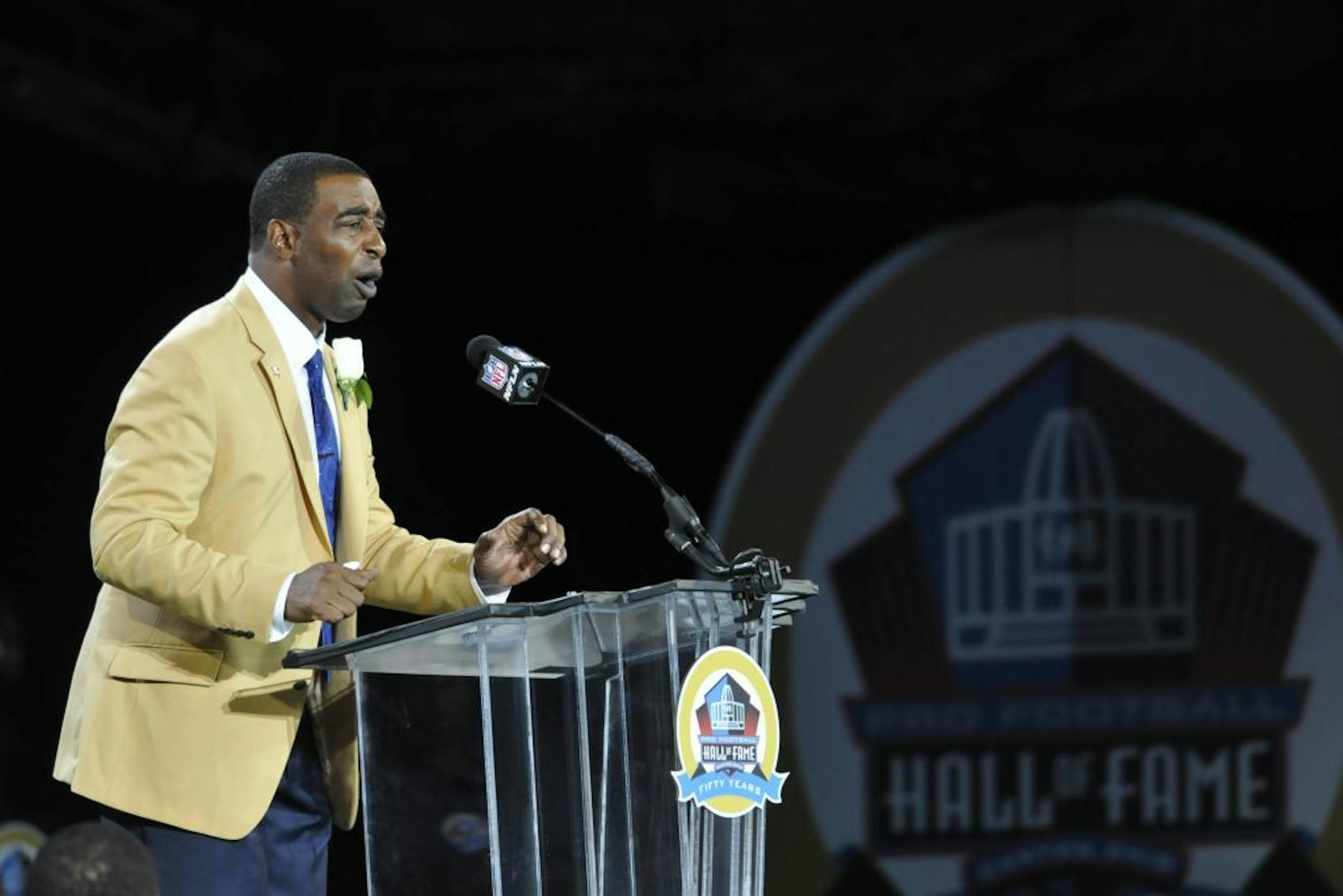 Hall of Fame inductee Cris Carter speaks during the induction ceremony at the Pro Football Hall of Fame Saturday, Aug. 3, 2013, in Canton, Ohio.