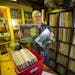 Host of The Jet Set Planet radio show on KFAI Glen Leslie showed off his first two records he bought at thrift shores that he now stores in the record