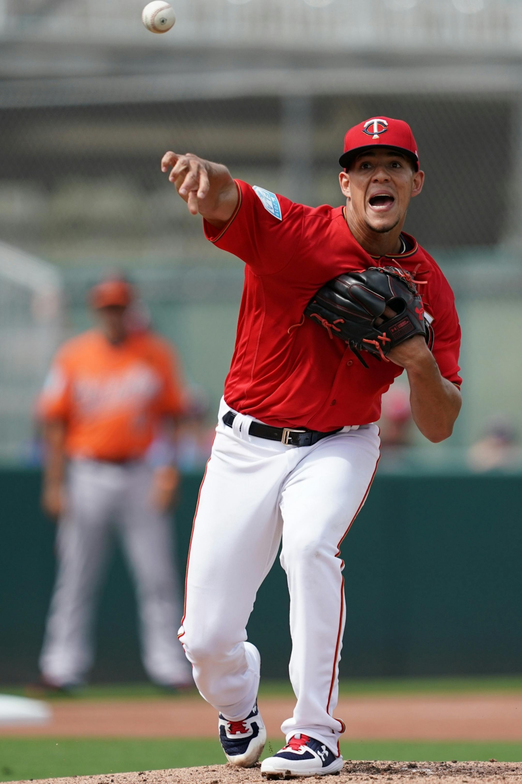 Minnesota Twins starting pitcher Jose Berrios (17) thew the ball to first to tag out Baltimore Orioles outfielder Joey Rickard (23) at first during Monday's game.