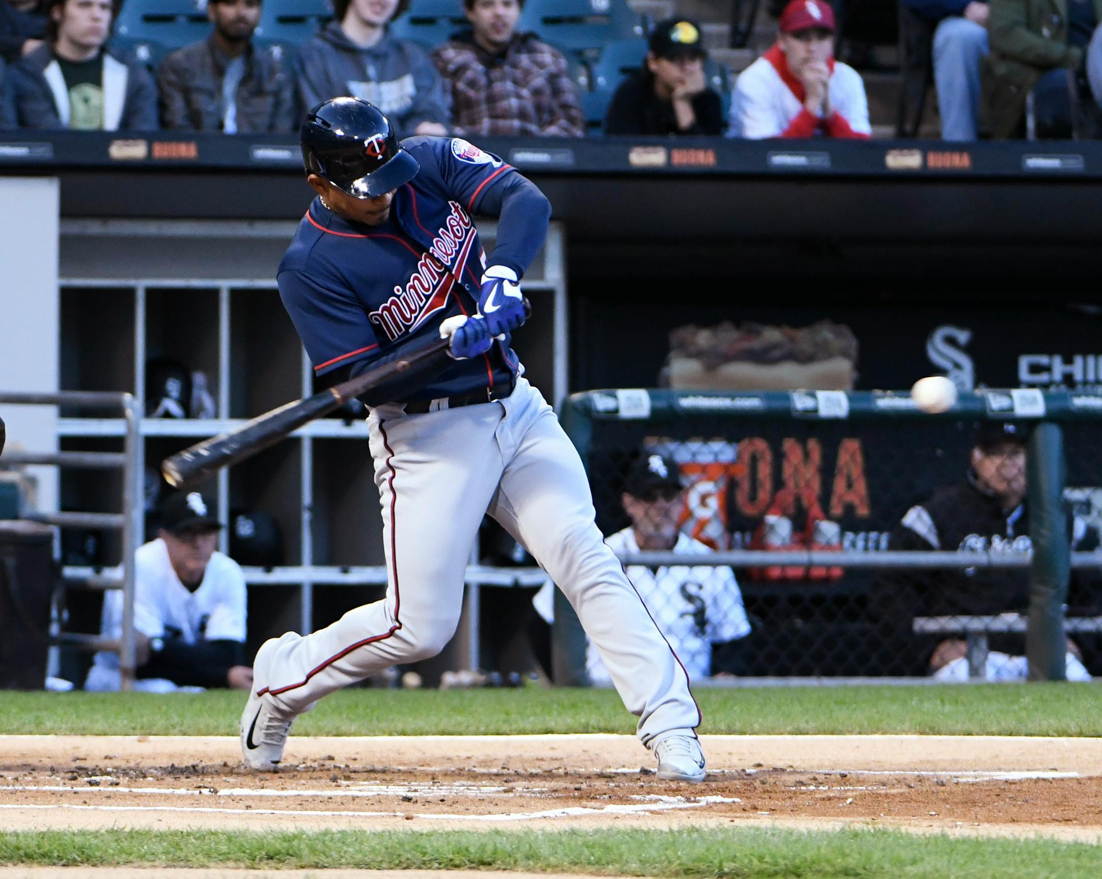 Minnesota Twins' Eduardo Escobar (5) swings into a three-run home run against the Chicago White Sox during the first inning of a baseball game, Thursday, May 11, 2017, in Chicago. (AP Photo/David Banks)