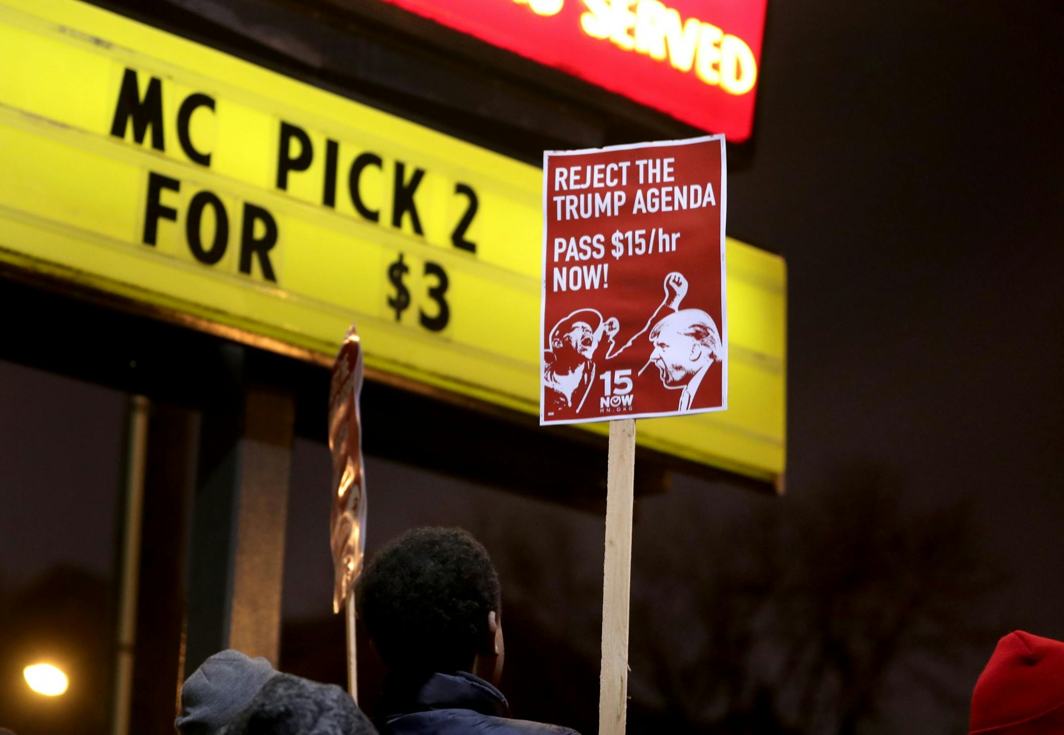 Protestors for Nationwide Fight for $15 Day of Disruption gathered outside McDonald's at 24th St. E. and Franklin Avenue, where for about a half hour protestors sat in a circle and blocked the intersection until they were arrested by Minneapolis police Tuesday, Nov. 29, 2016, in Minneapolis, MN. Here, protestors hold signs outside the McDonald's at 24th St. E. and Franklin Ave.