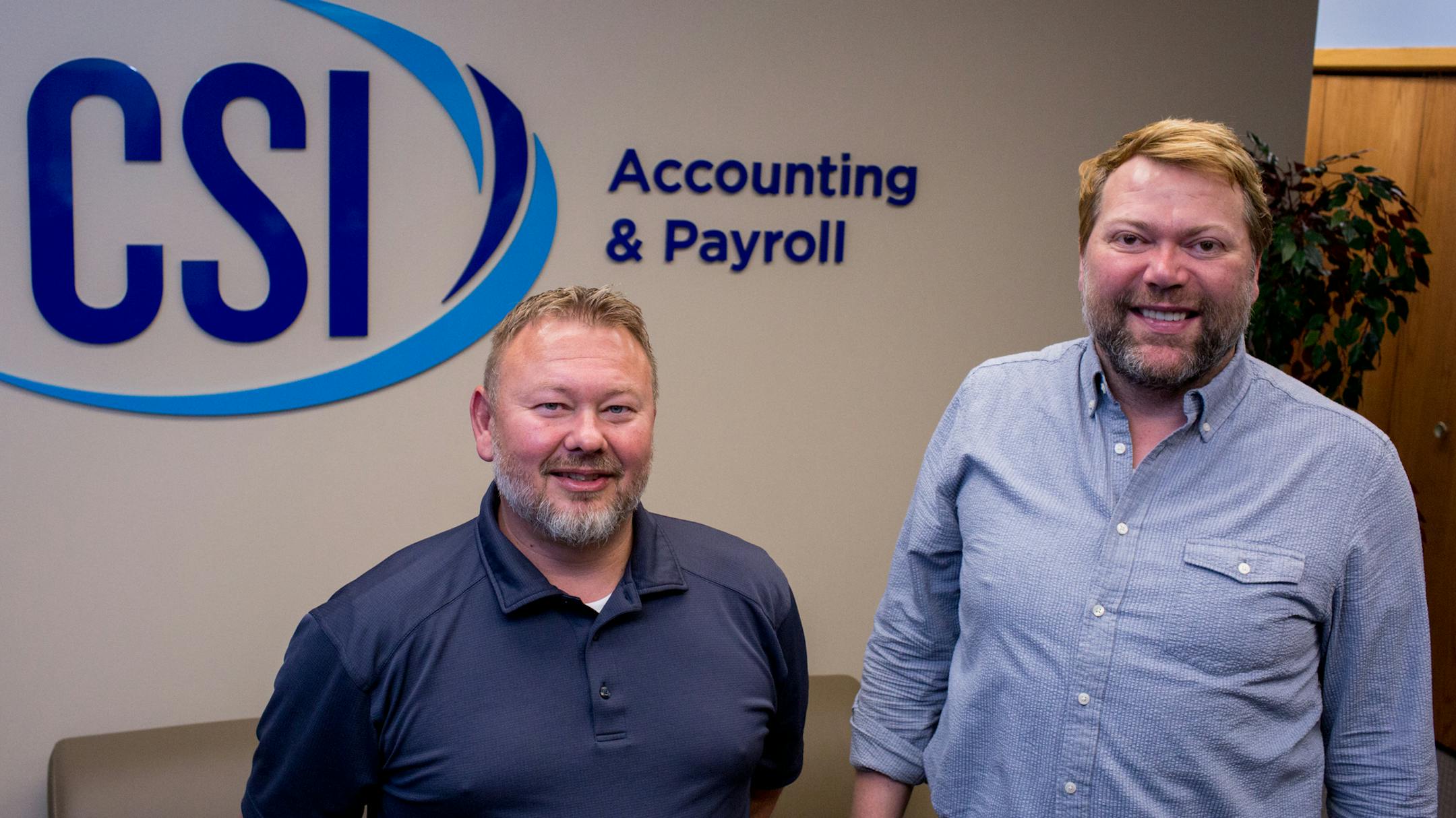 Bret Asmussen, left, and Lee Goudzwaard-Vaught of CSI Accounting expected an uptick in work as the new rules took effect.