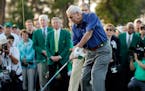 Arnold Palmer hits on the first tee for the honorary tee off before the first round of the Masters golf tournament Thursday, April 9, 2015, in Augusta