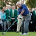 Arnold Palmer hits on the first tee for the honorary tee off before the first round of the Masters golf tournament Thursday, April 9, 2015, in Augusta