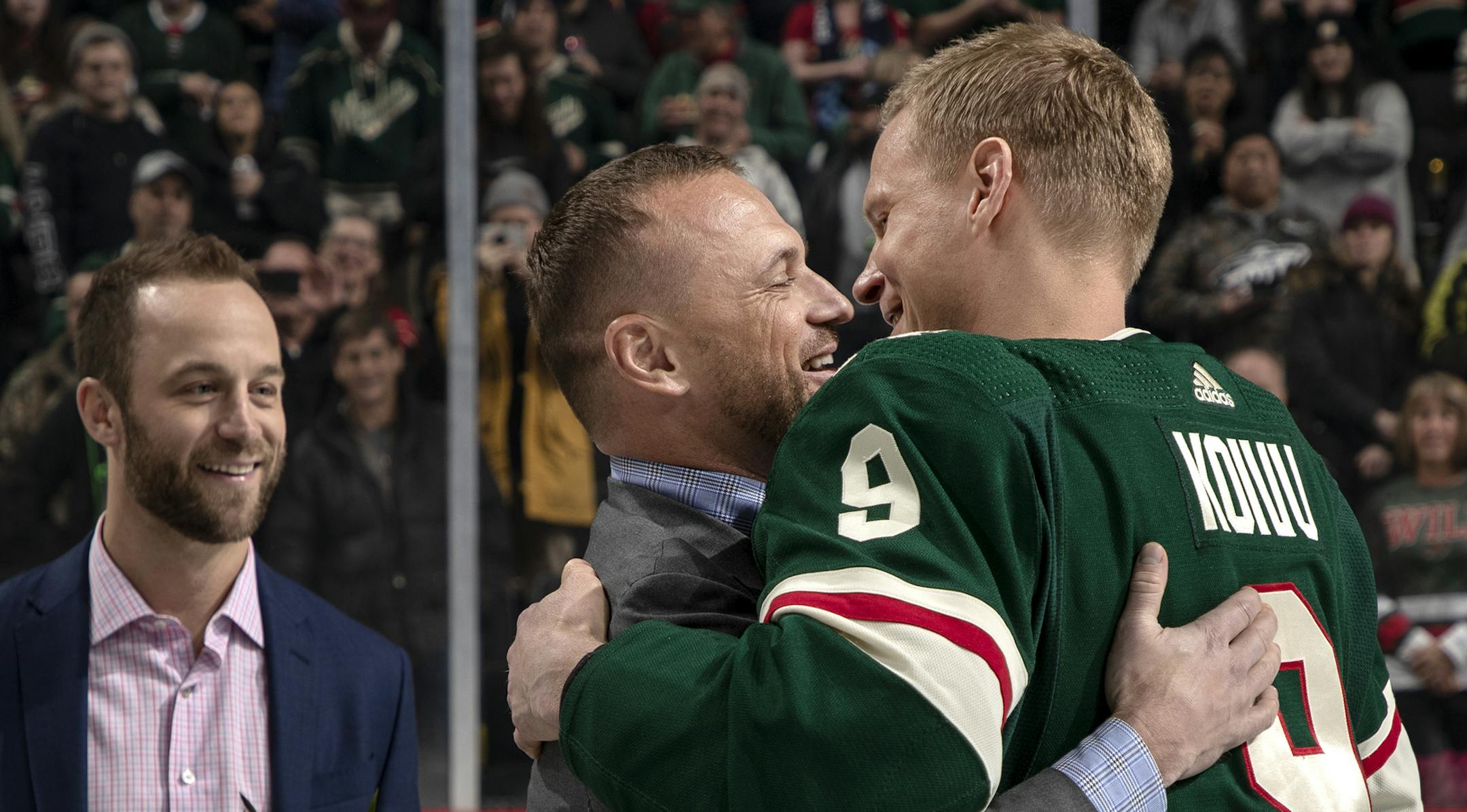 Mikko Koivu got a hug from former teammate Marian Gaborik as he was honored for his 1,000th game. "We had fun memories," Gaborik said.