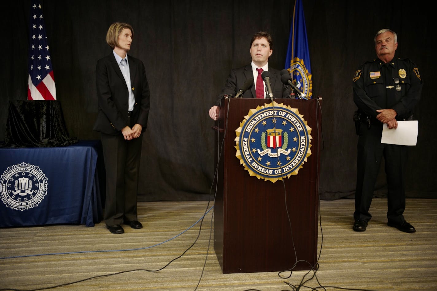 FBI Special Agent Jill Sanborn, US Attorney Christopher Myers, and Grand Rapids Police Chief Scott Johnson addressed the recovery. Judy Garland's stolen ruby slippers were found 13 years after Minnesota museum theft..