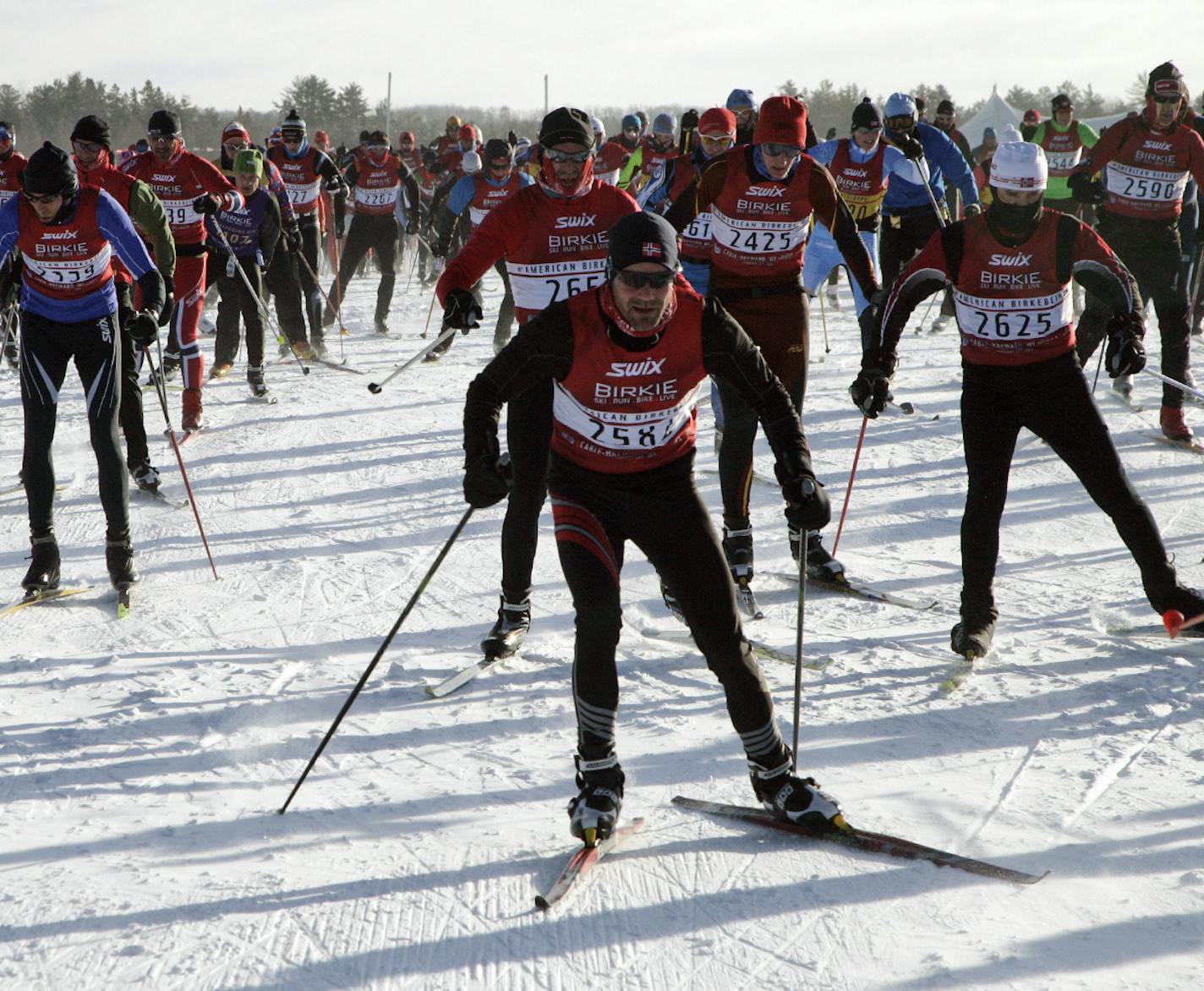 Competitors start the American Birkebeiner ski race in Cable, Wis., on Saturday, Feb. 22, 2014. The race covers 50 kilometers to Hayward, Wis. (AP Photo/Paul M. Walsh) ORG XMIT: WIPW101