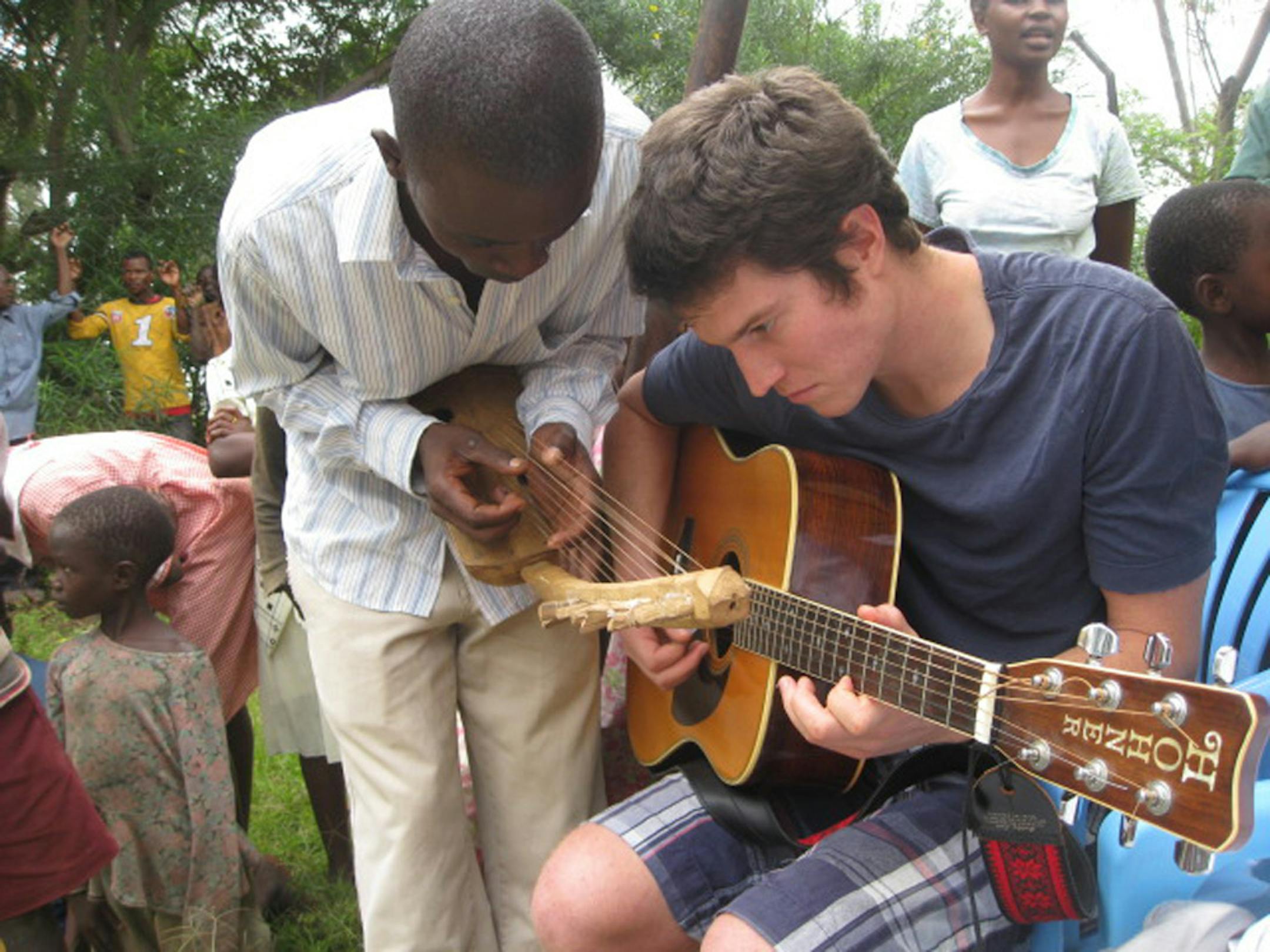 ugandaTR032413 . John Wandschneider of Portland, Ore., jammed during a recent visit to Nabugoye, Uganda, with a member of of the Hope Troupe Uganda -- a group of orphaned musicians and dancers.( photos by Curt Brown)