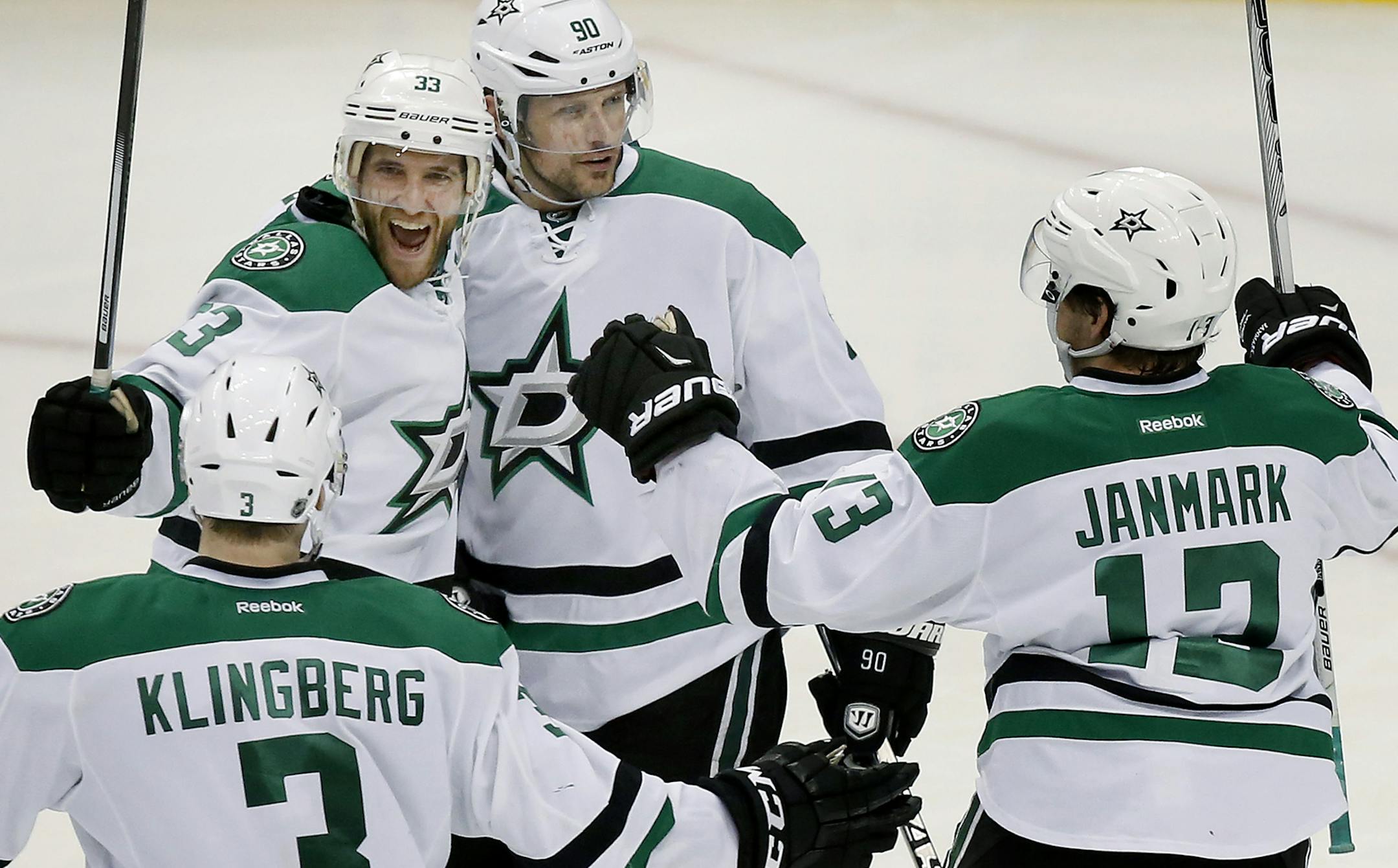 Alex Goligoski (33) celebrated with teammates after scoring a goal in the third period. ] CARLOS GONZALEZ cgonzalez@startribune.com - April 24, 2016, St. Paul, MN, Xcel Energy Center, NHL, Hockey, Minnesota Wild vs. Dallas Stars, First Round Stanley Cup Playoffs, Game 6