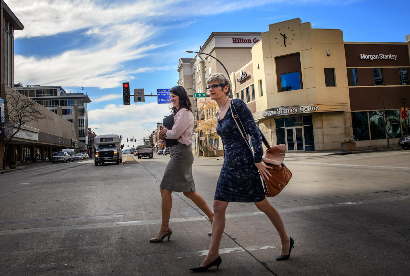 Lisa Clarke, executive director of the DMC Economic Development Agency, right and Mary Welder, walked across Broadway in Rochester, MN. ] GLEN STUBBE * gstubbe@startribune.com Tuesday, November 10, 2015 Profile of Lisa Clarke, executive director of the DMC Economic Development Agency. This is the position responsible for making the DMC project happen. She implements the DMC vision, coordinates with city of Rochester, Olmsted County and other community organizations, works with private developers