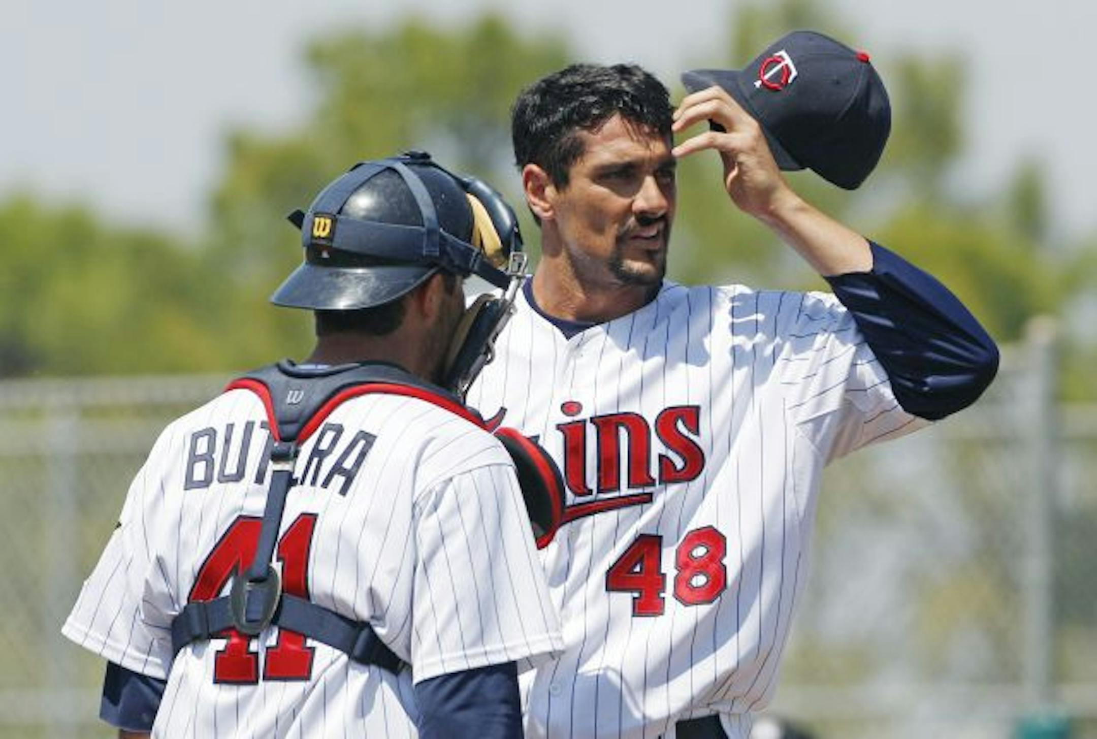 Catcher Drew Butera talked to Carl Pavano after the Twins righthander gave up a first-inning homer to the Yankees' Robinson Cano on Sunday.